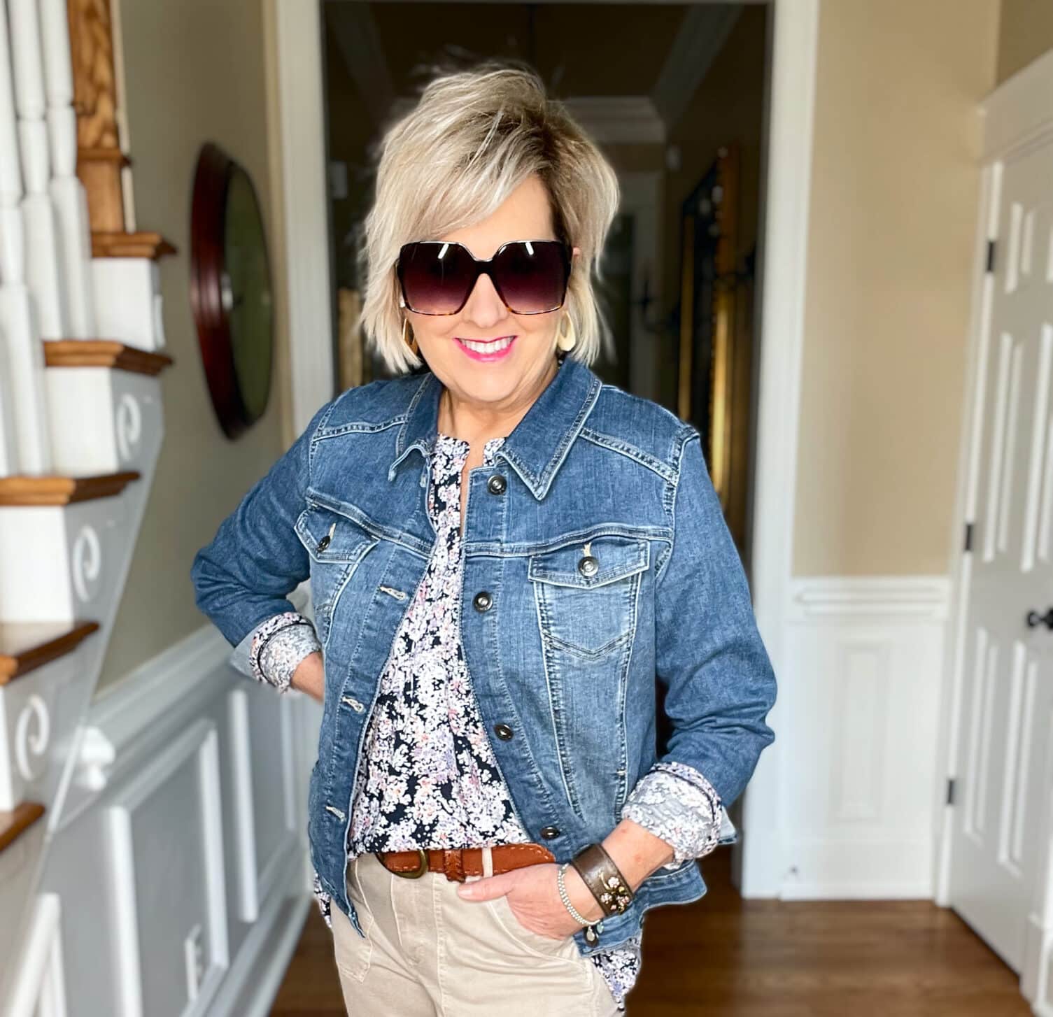 Over 40 Fashion Blogger, Tania Stephens is wearing a floral top and beige pants from JJill with a denim jacket14