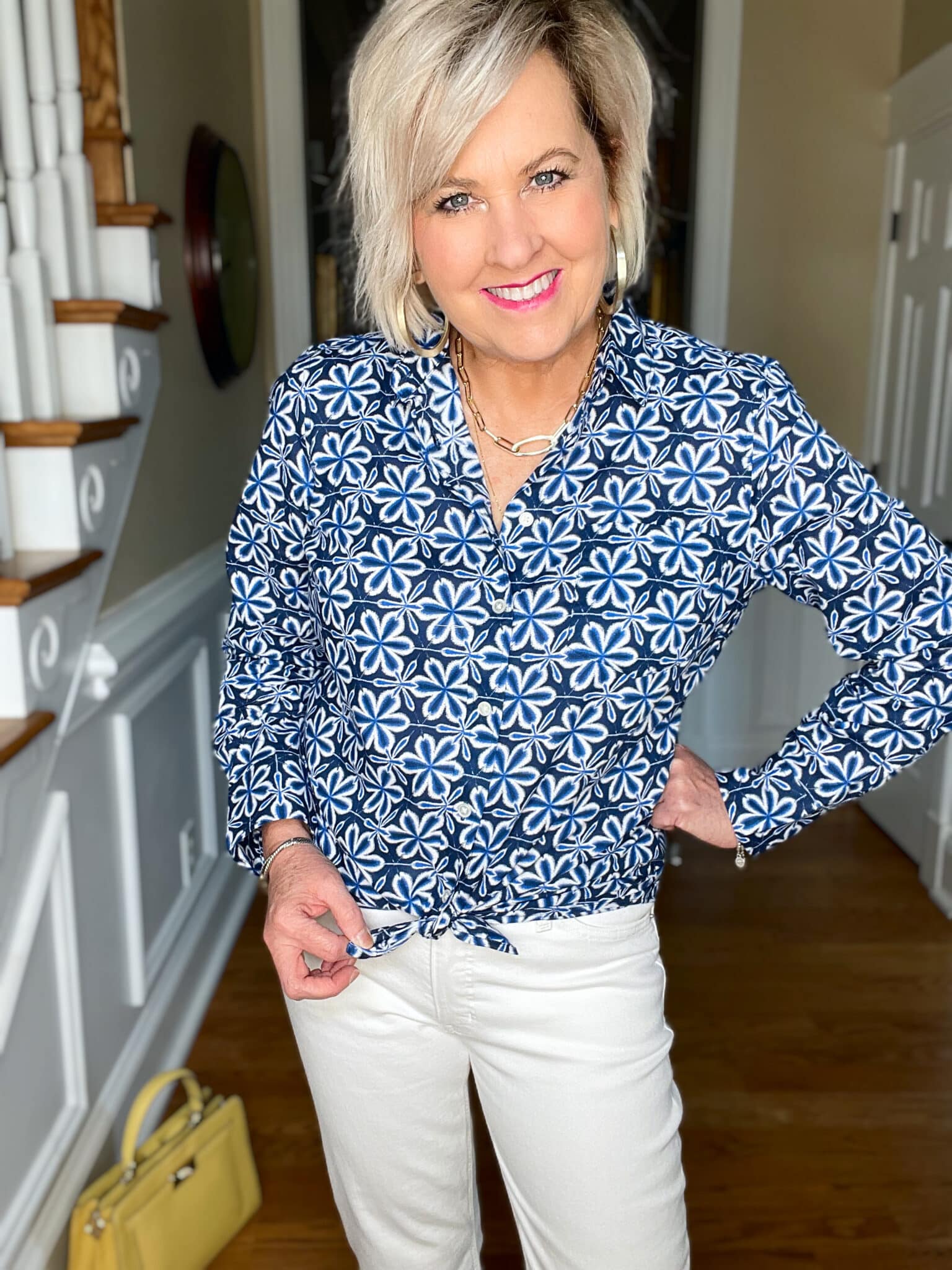 Over 40 Fashion Blogger, Tania Stephens is wearing white crop jeans and a button up blue print shirt11