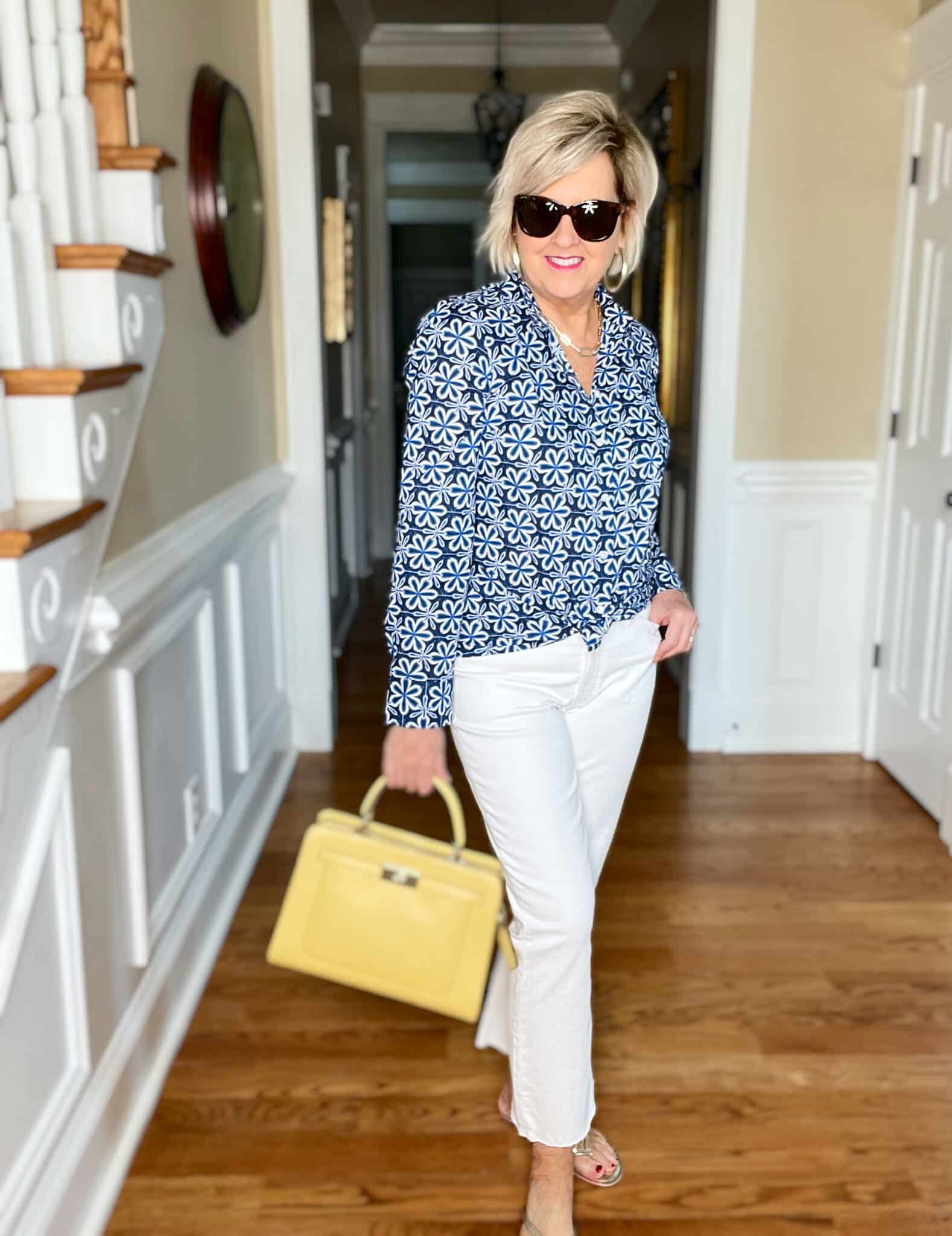 Over 40 Fashion Blogger, Tania Stephens is wearing white crop jeans and a button up blue print shirt 20