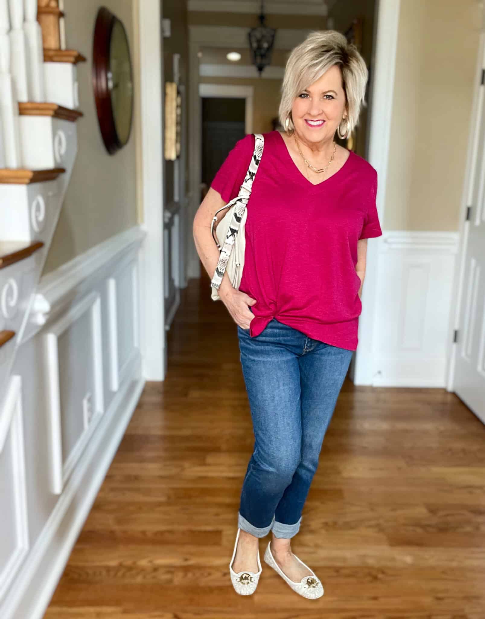 Over 40 Fashion Blogger, Tania Stephens is wearing a bright pink tee with cuffed jeans and loafers21