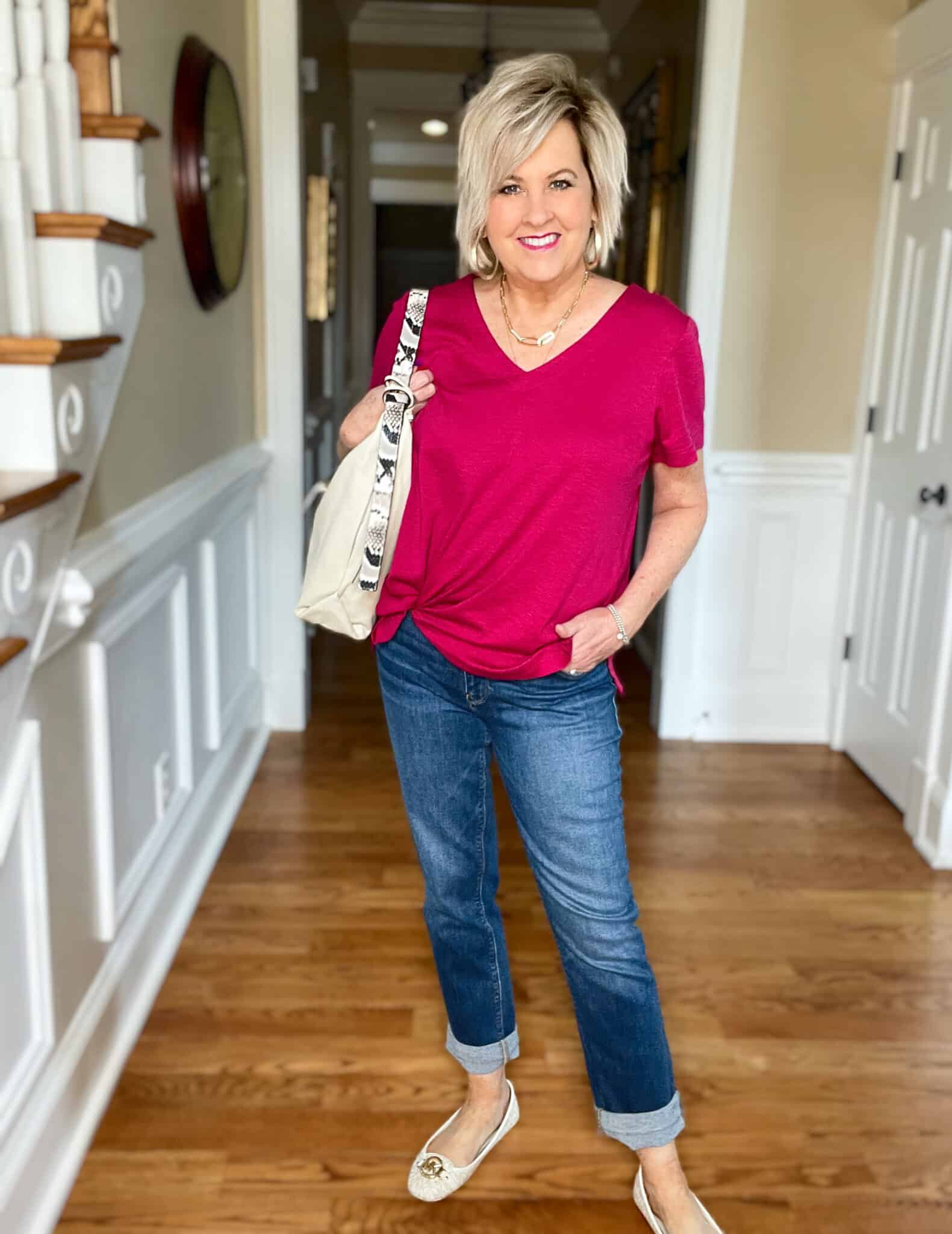 Over 40 Fashion Blogger, Tania Stephens is wearing a bright pink tee with cuffed jeans and loafers8