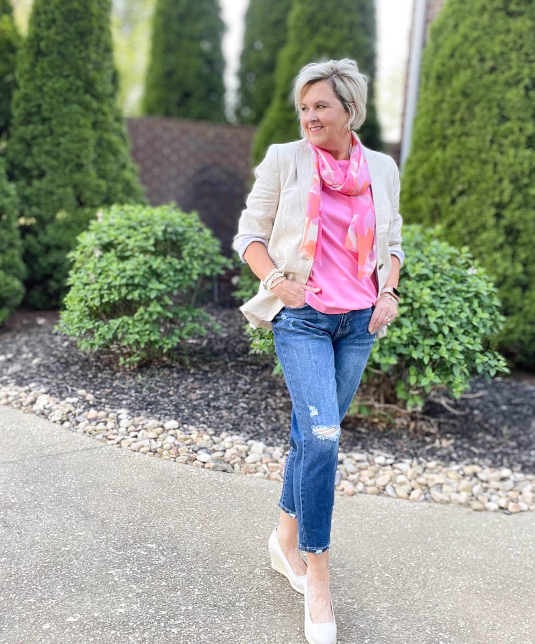 Over 40 Fashion Blogger, Tania Stephens is wearing a pink tee and jeans27