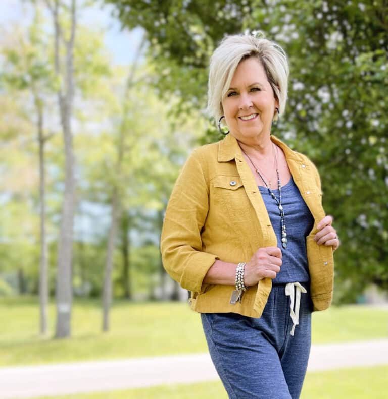 Over 40 Fashion Blogger, Tania Stephens is wearing a blue jumpsuit from Amazon and a mustard crop jacket from J.Jill26