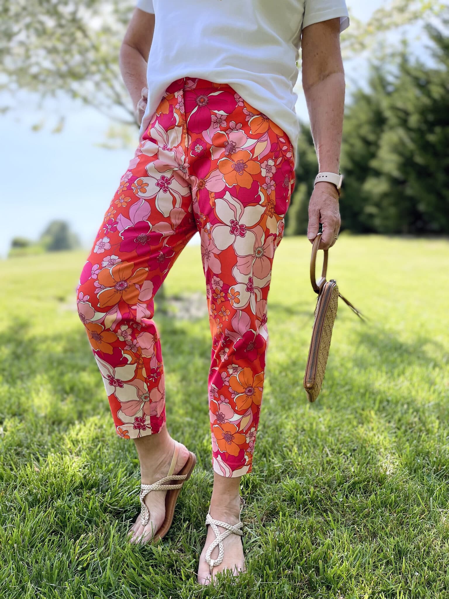 Over 40 Fashion Blogger, Tania Stephens is wearing floral pants, and white tee, and a denim jacket15