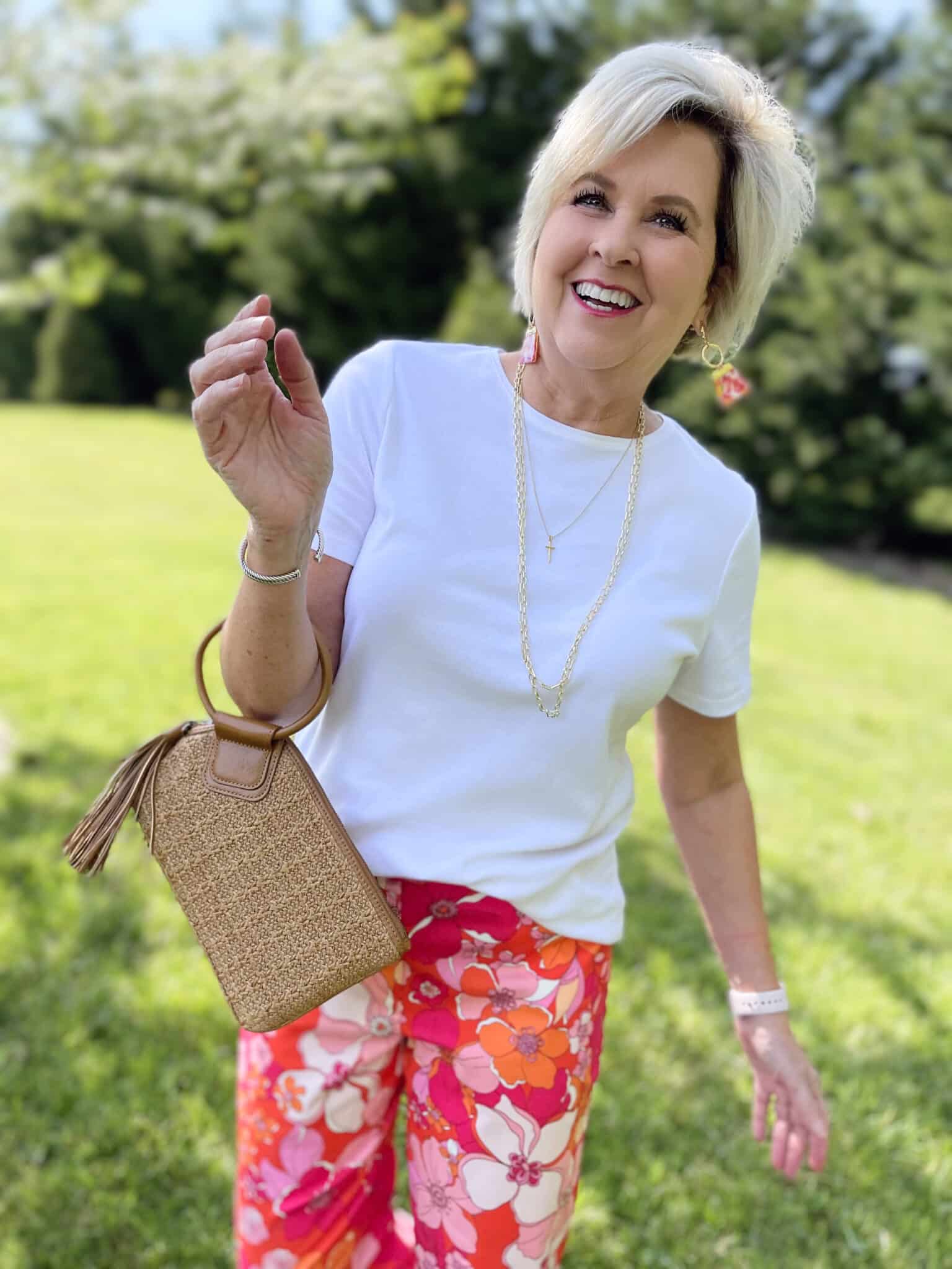 Over 40 Fashion Blogger, Tania Stephens is wearing floral pants, and white tee, and a denim jacket16