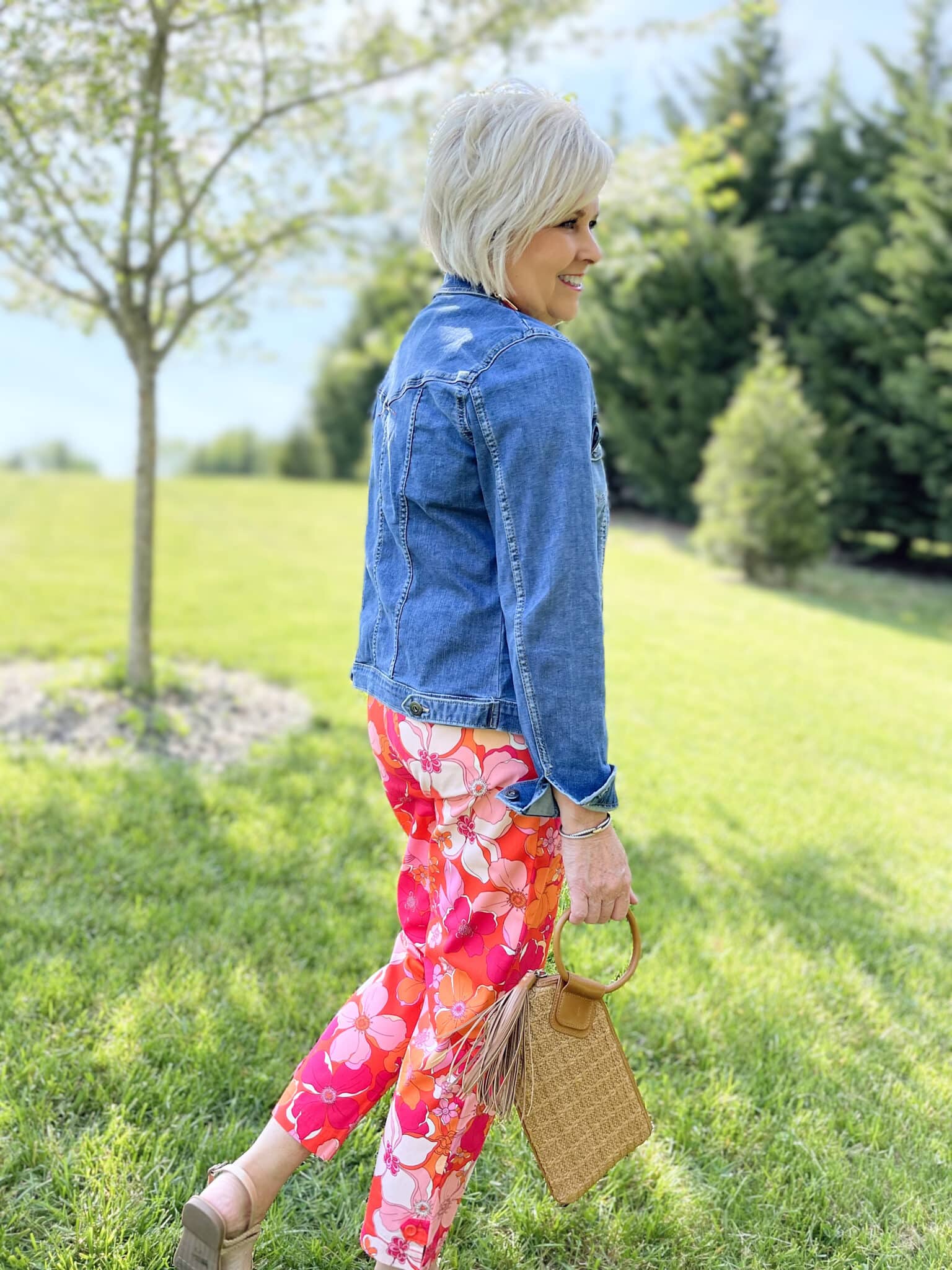 Over 40 Fashion Blogger, Tania Stephens is wearing floral pants, and white tee, and a denim jacket20
