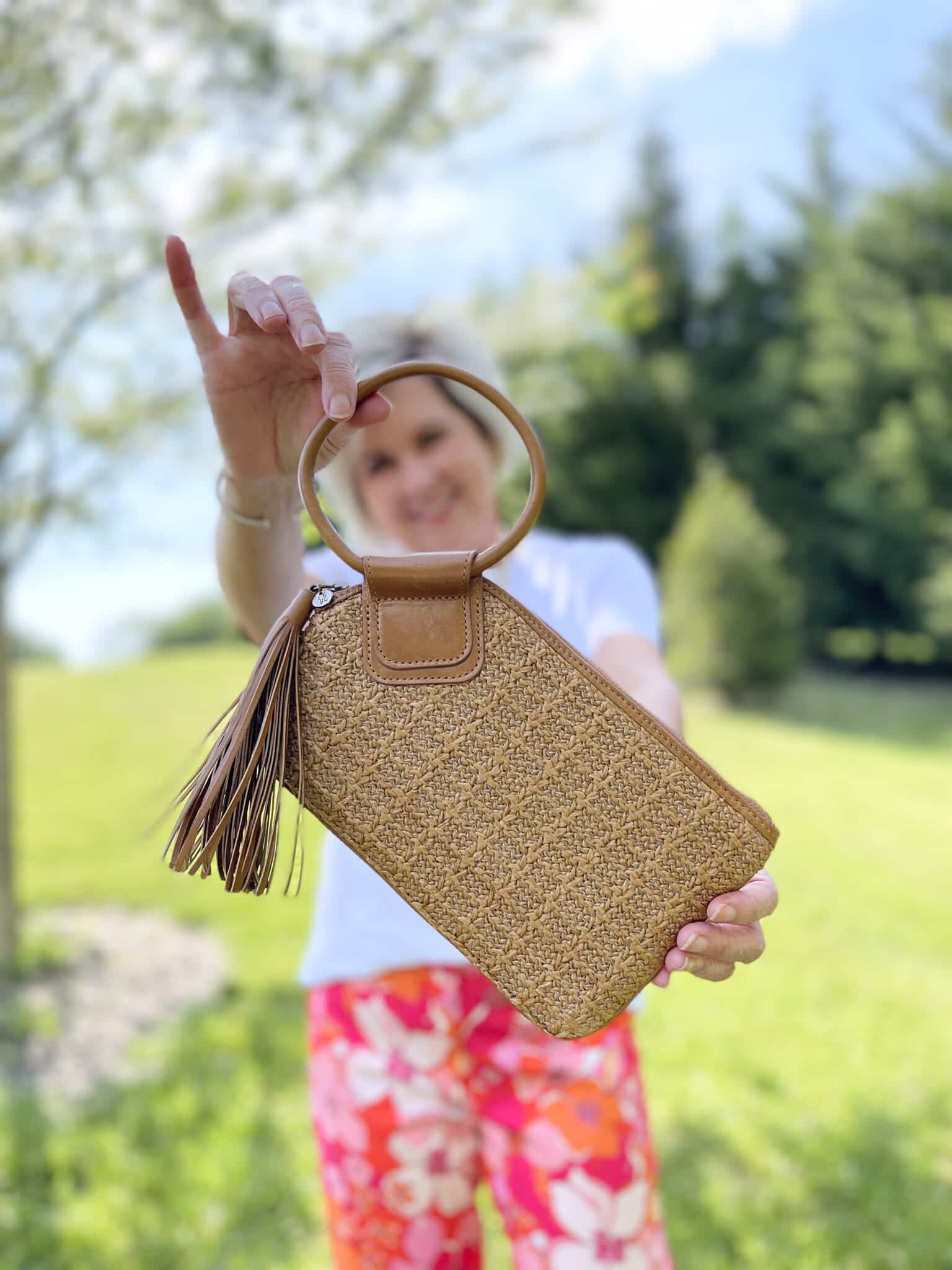 Over 40 Fashion Blogger, Tania Stephens is wearing floral pants, and white tee, and a denim jacket21