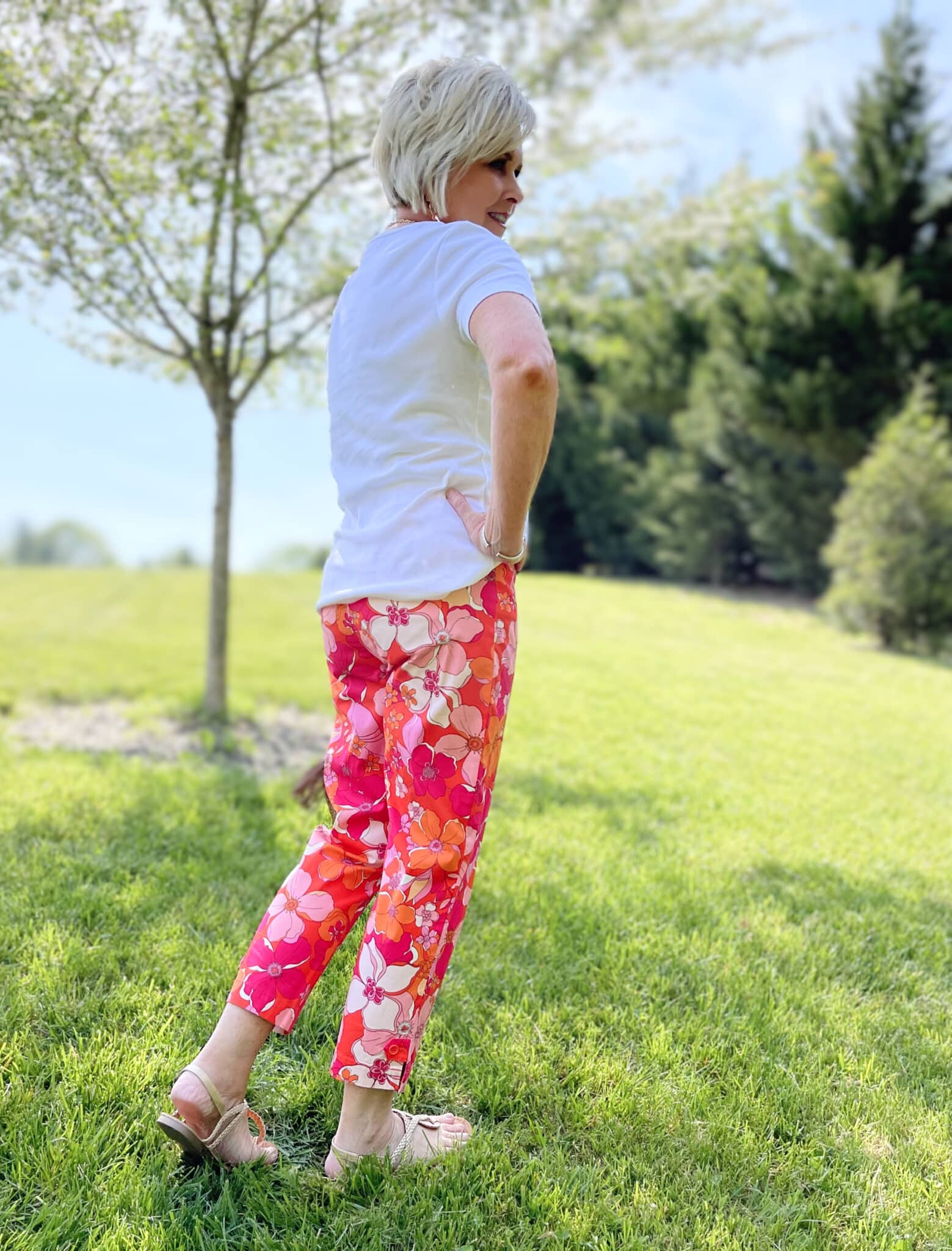 Over 40 Fashion Blogger, Tania Stephens is wearing floral pants, and white tee, and a denim jacket3