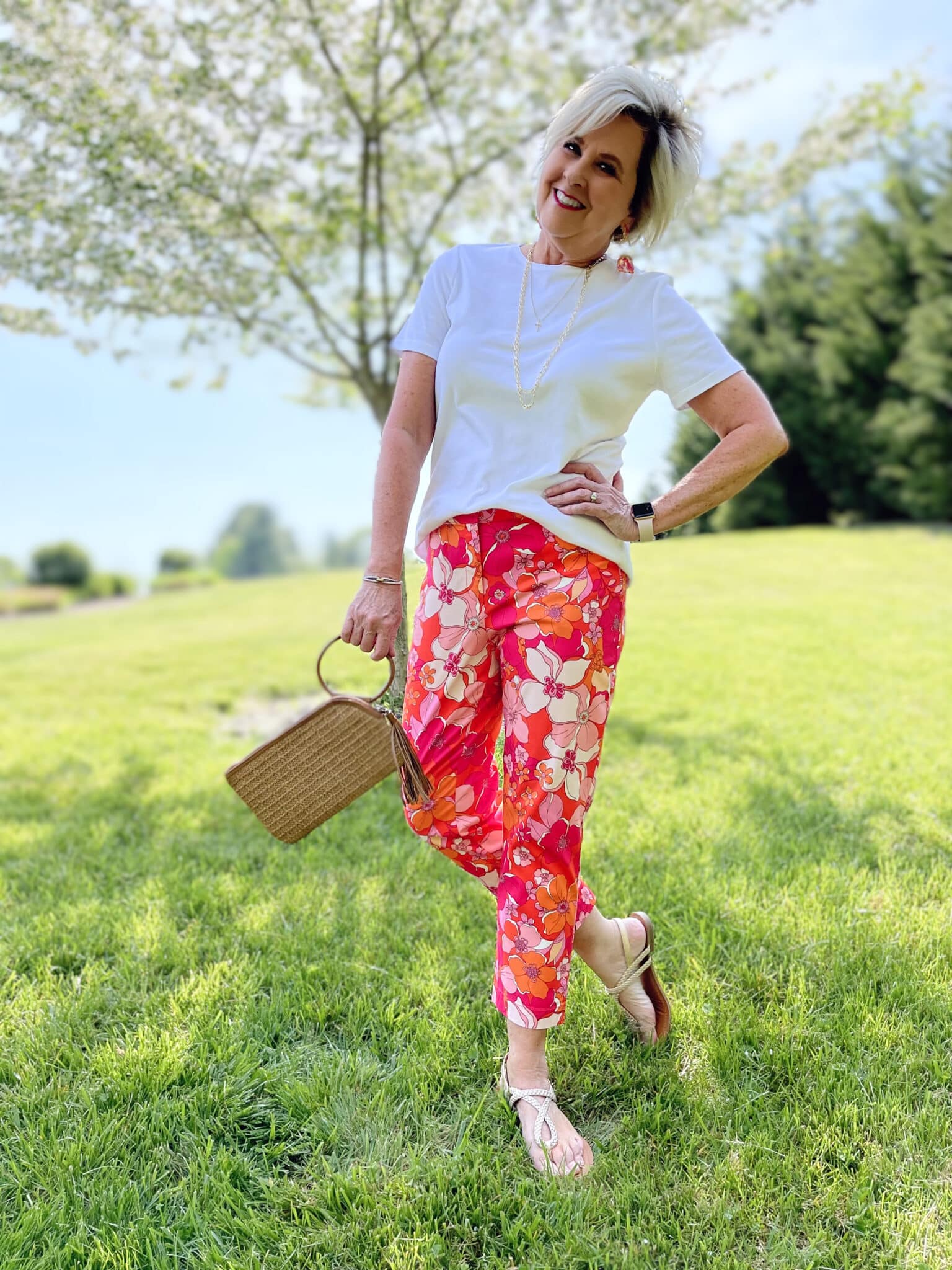 Over 40 Fashion Blogger, Tania Stephens is wearing floral pants, and white tee, and a denim jacket4