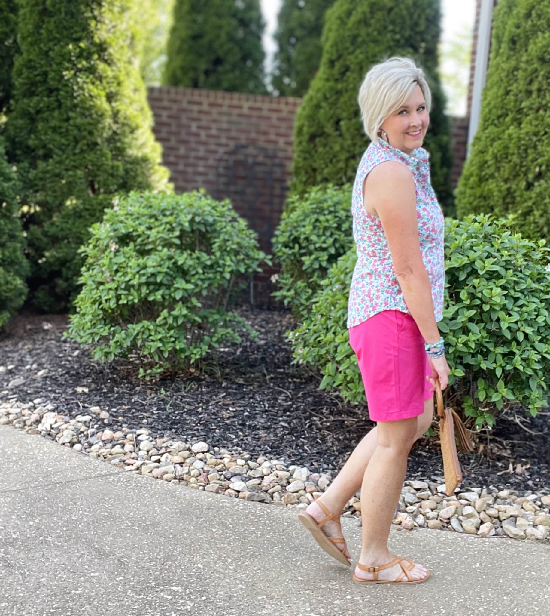 Over 40 Fashion Blogger, Tania Stephens is wearing pink shorts and a floral sleeveless top from J Crew Factory11