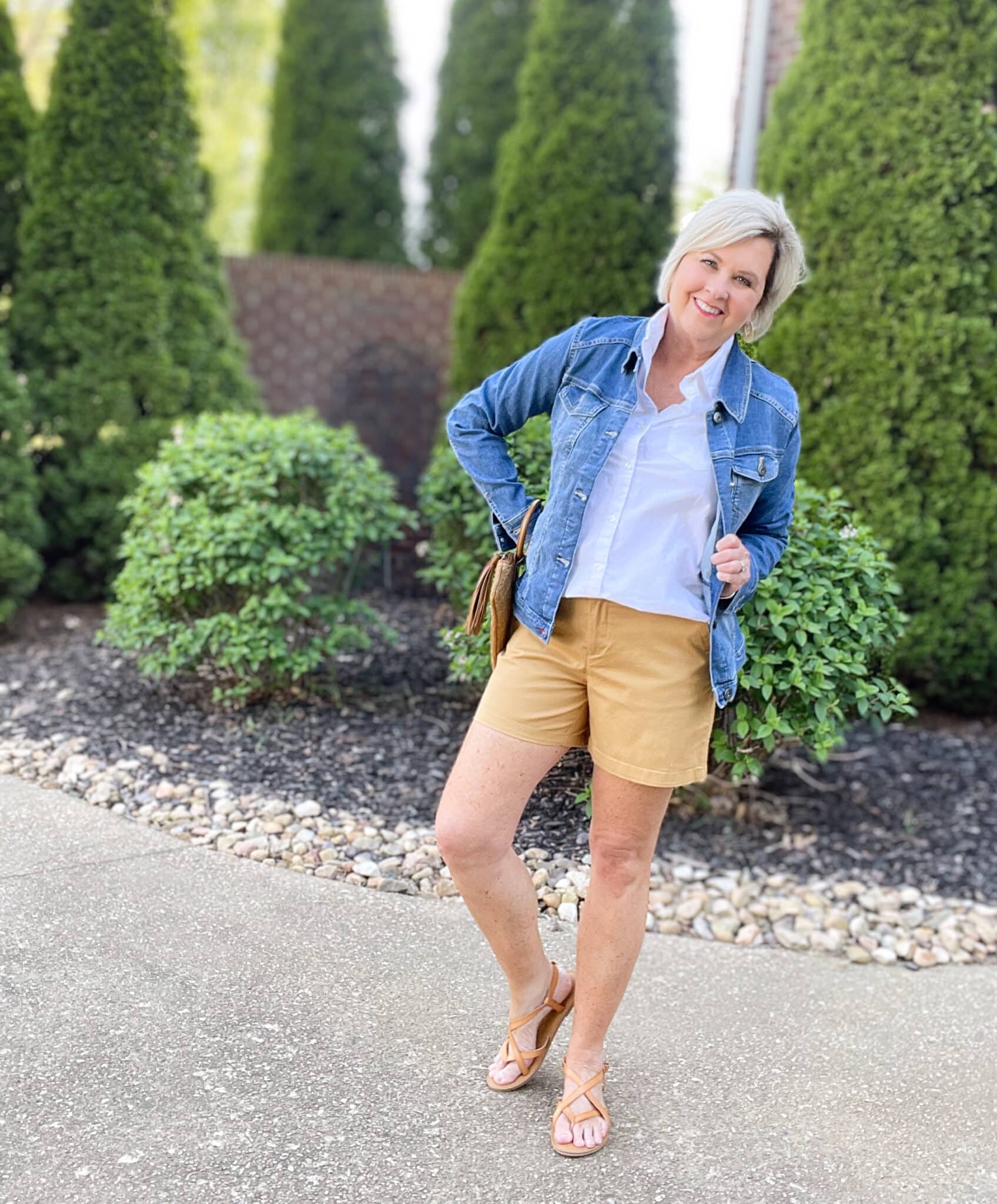 Over 40 Fashion Blogger, Tania Stephens is wearing tan shorts, a white shirt, and a denim jacket19