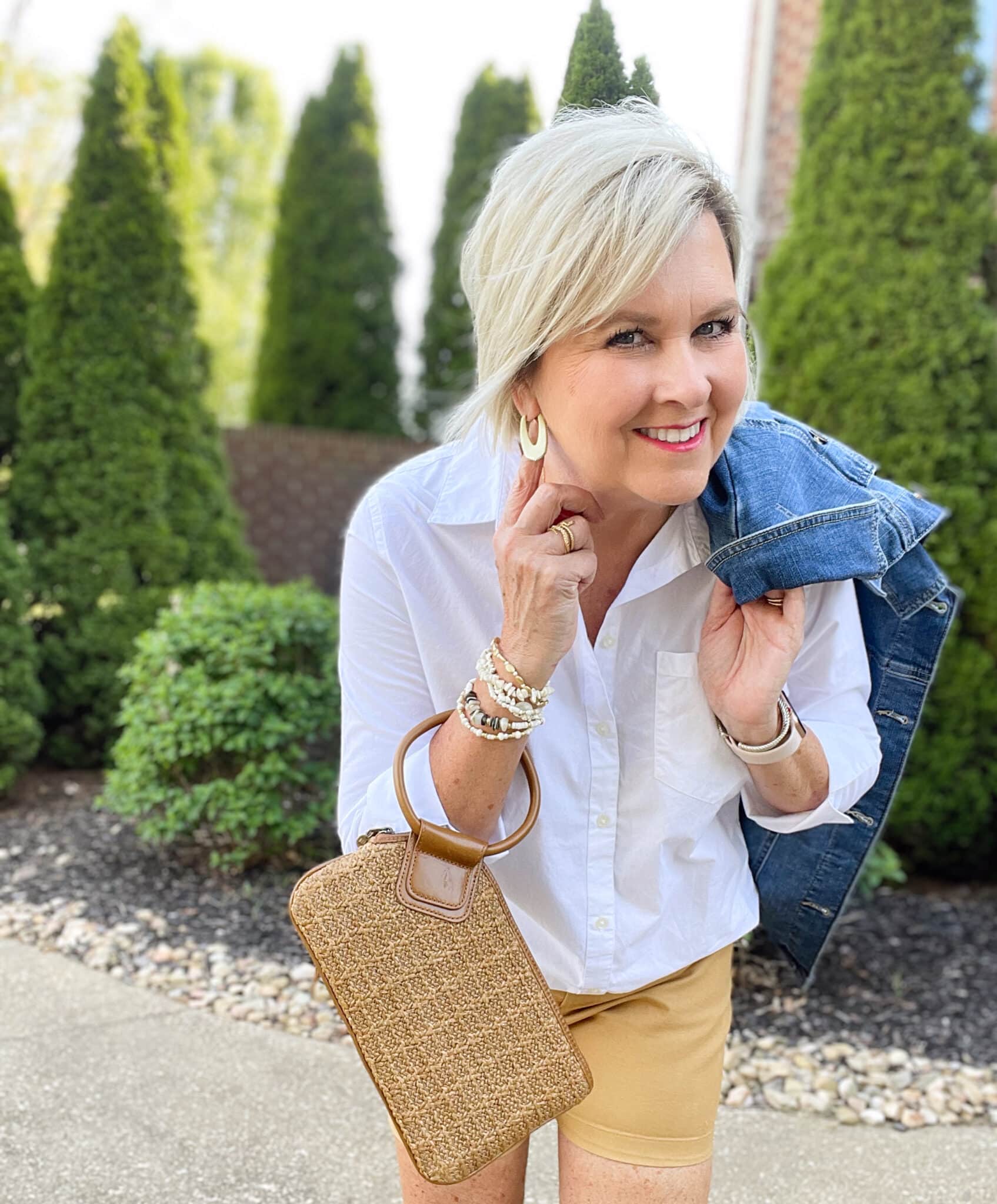 Over 40 Fashion Blogger, Tania Stephens is wearing tan shorts, a white shirt, and a denim jacket20