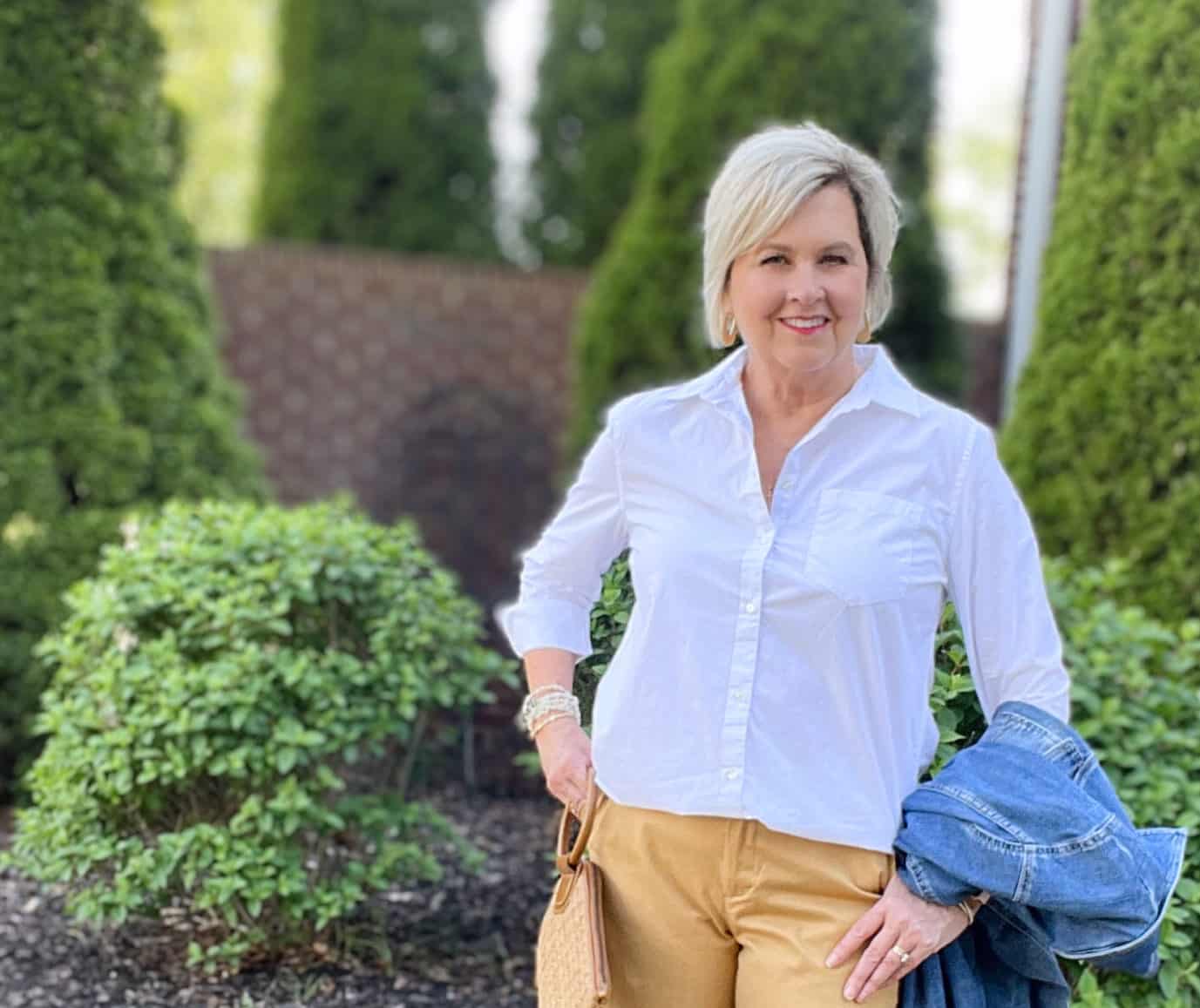 Over 40 Fashion Blogger, Tania Stephens is wearing tan shorts, a white shirt, and a denim jacket8