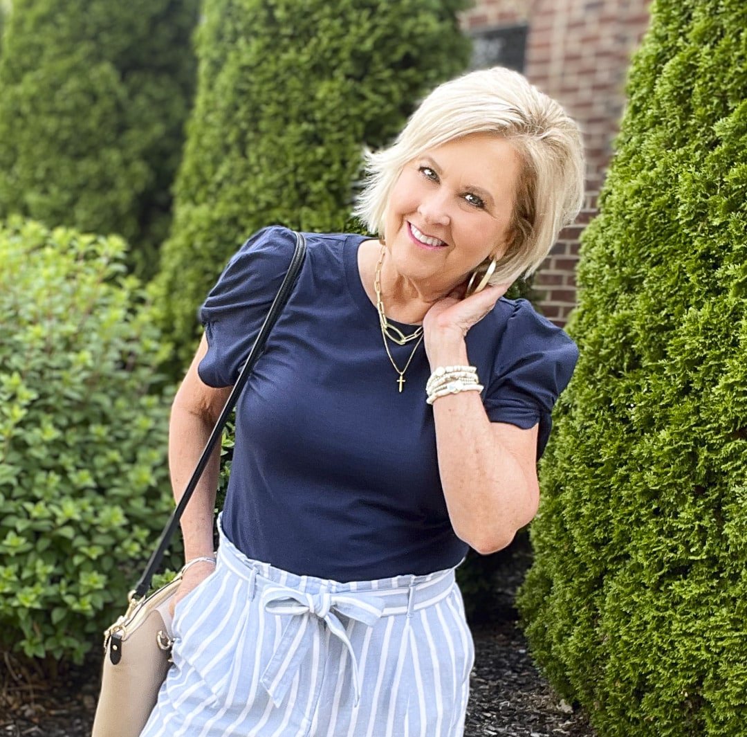 Over 40 Fashion Blogger, Tania Stephens is styling paperbag striped shorts from Loft with 2 different tops21