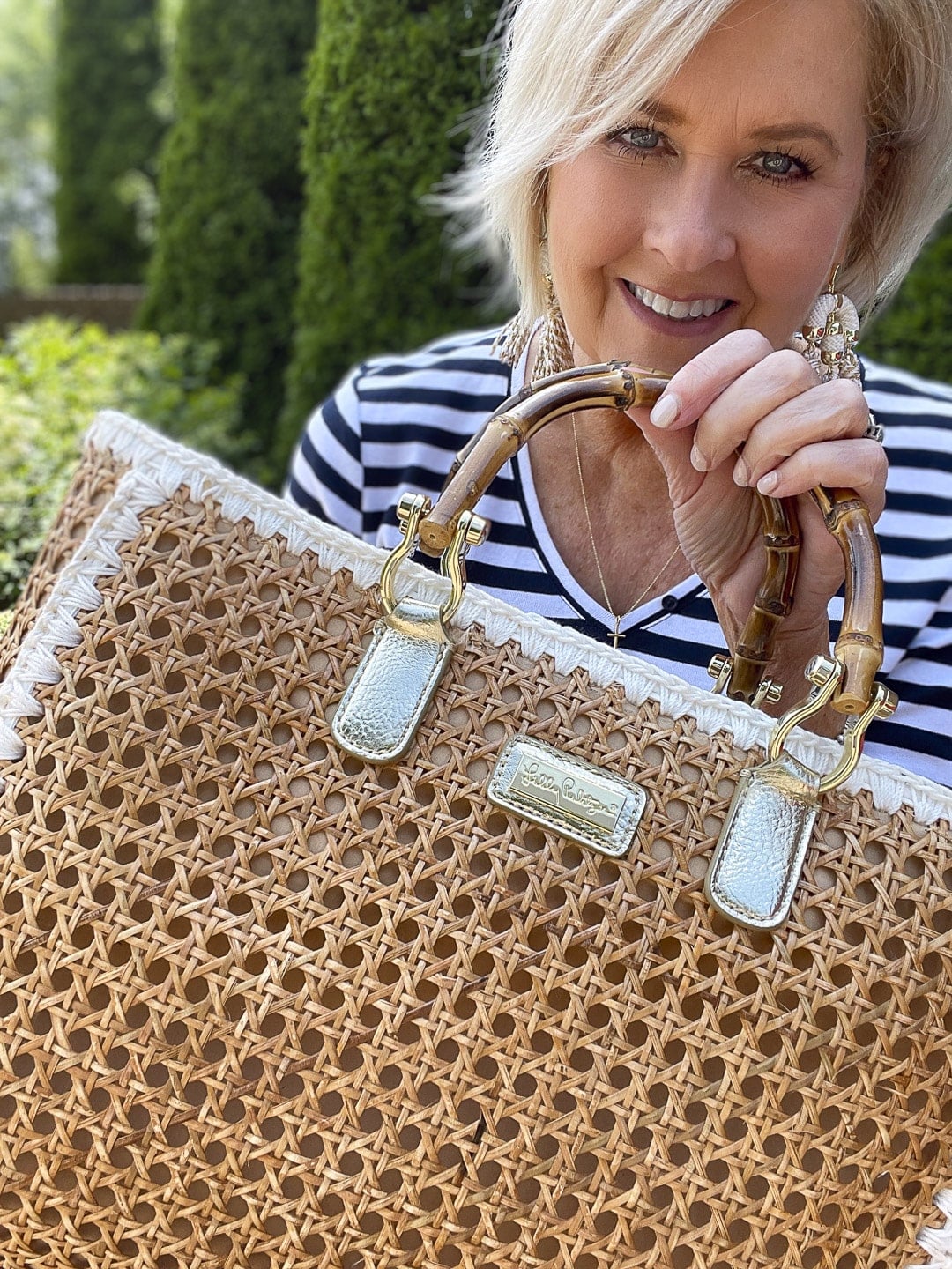 Over 40 Fashion Blogger, Tania Stephens is celebrating 2022 4th of July in a navy & white tee and white shorts 12