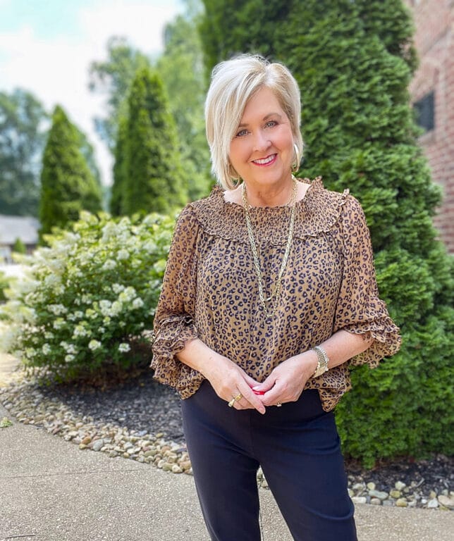 Over 40 Fashion Blogger, Tania Stephens is styling a leopard off the shoulder top with a pair of SPANX black pants13
