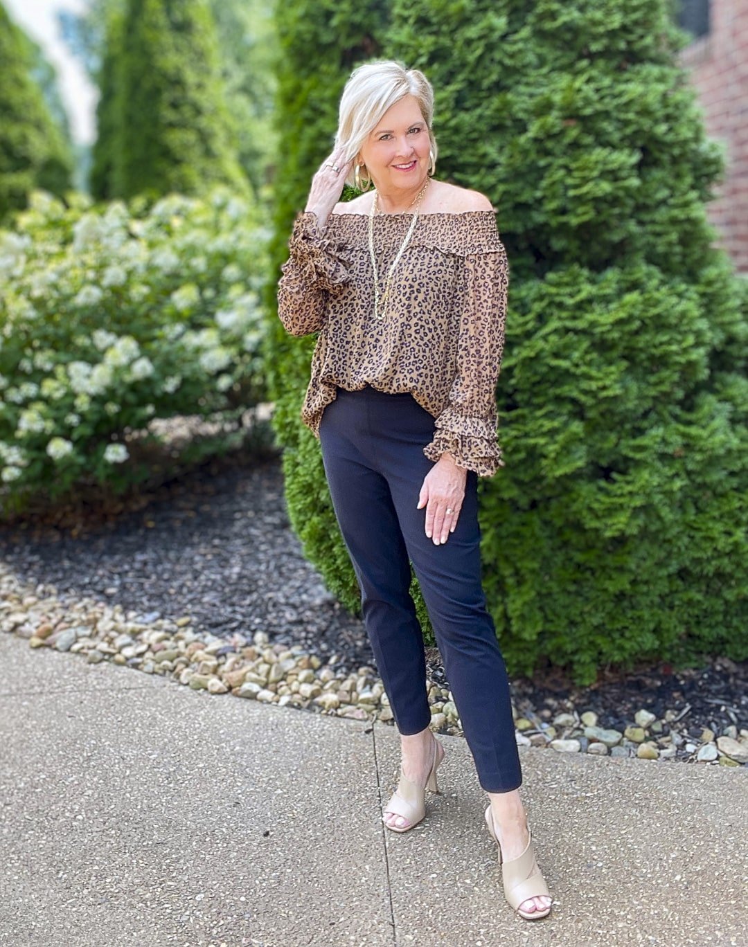 Over 40 Fashion Blogger, Tania Stephens is styling a leopard off the shoulder top with a pair of SPANX black pants 7