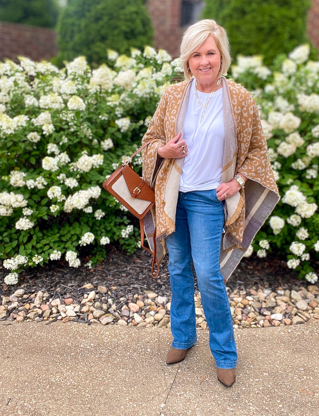 Over 40 Fashion Blogger, Tania Stephens is wearing a blanket poncho with jeans from Walmart 1 