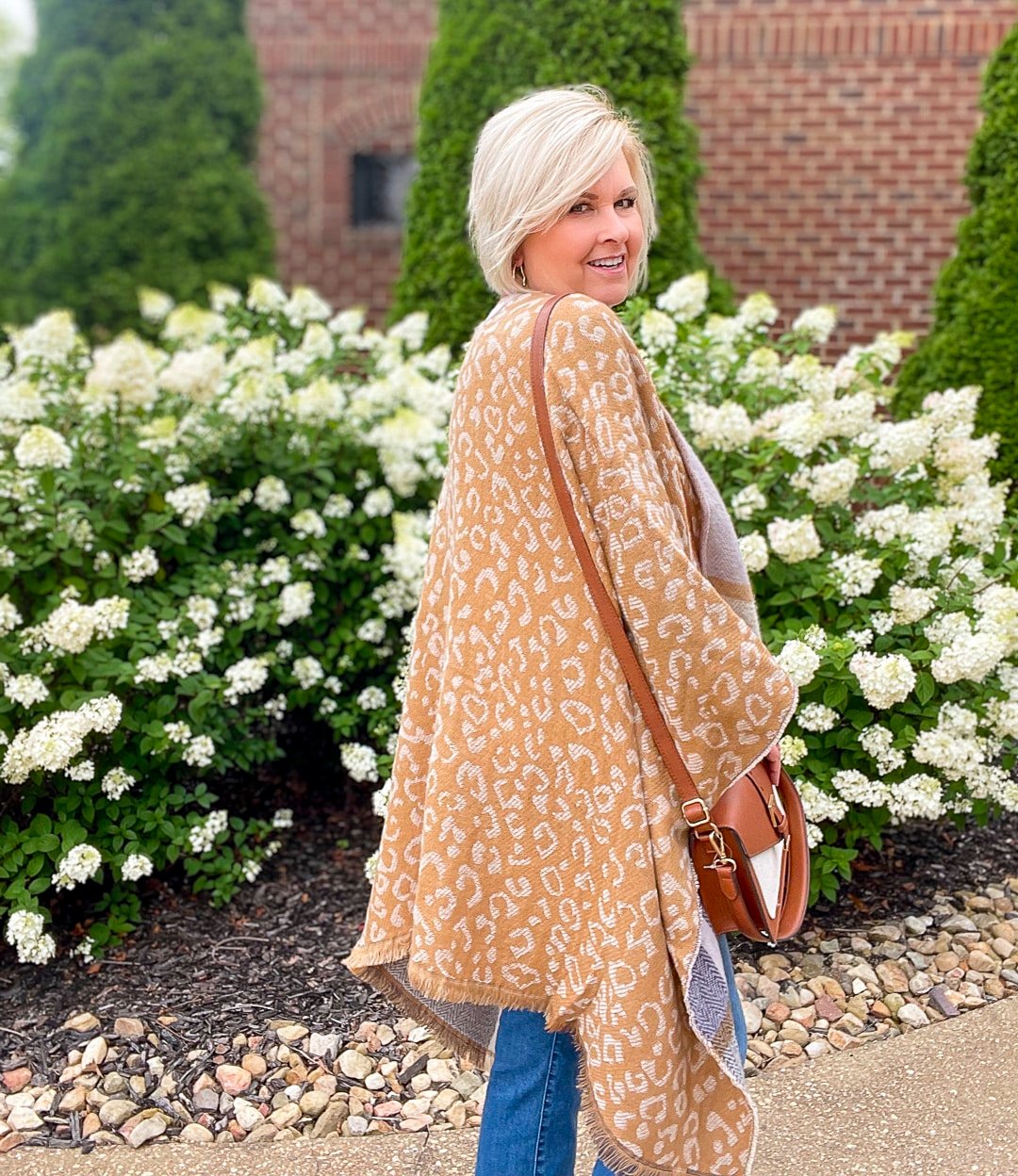 Over 40 Fashion Blogger, Tania Stephens is wearing a blanket poncho with jeans from Walmart 10