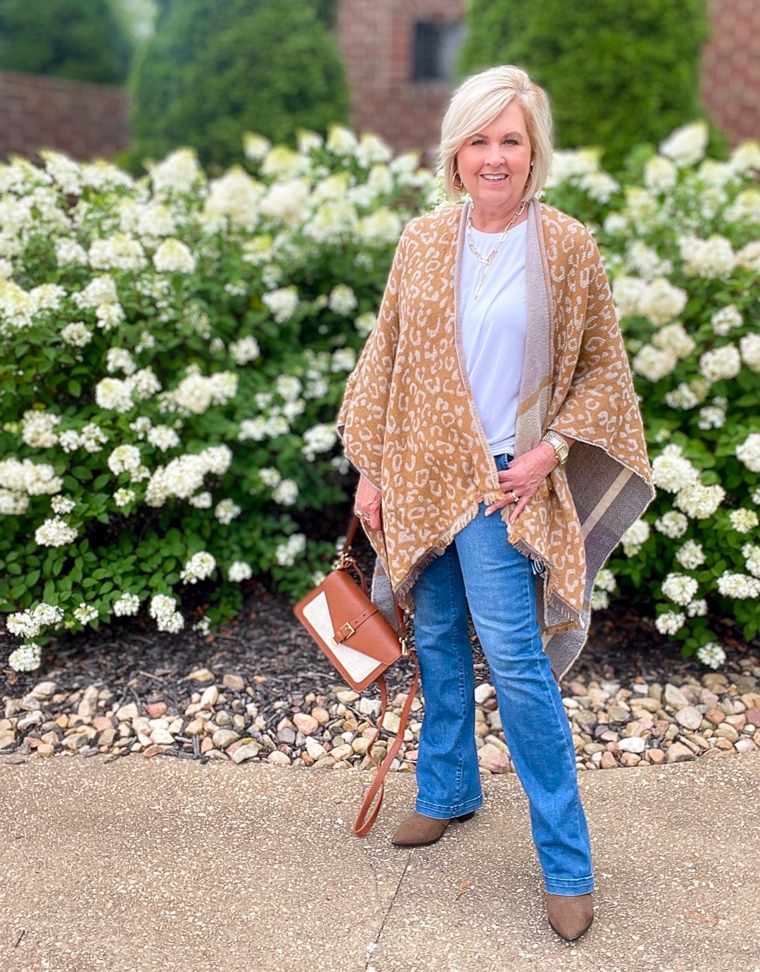 Over 40 Fashion Blogger, Tania Stephens is wearing a blanket poncho with jeans from Walmart4