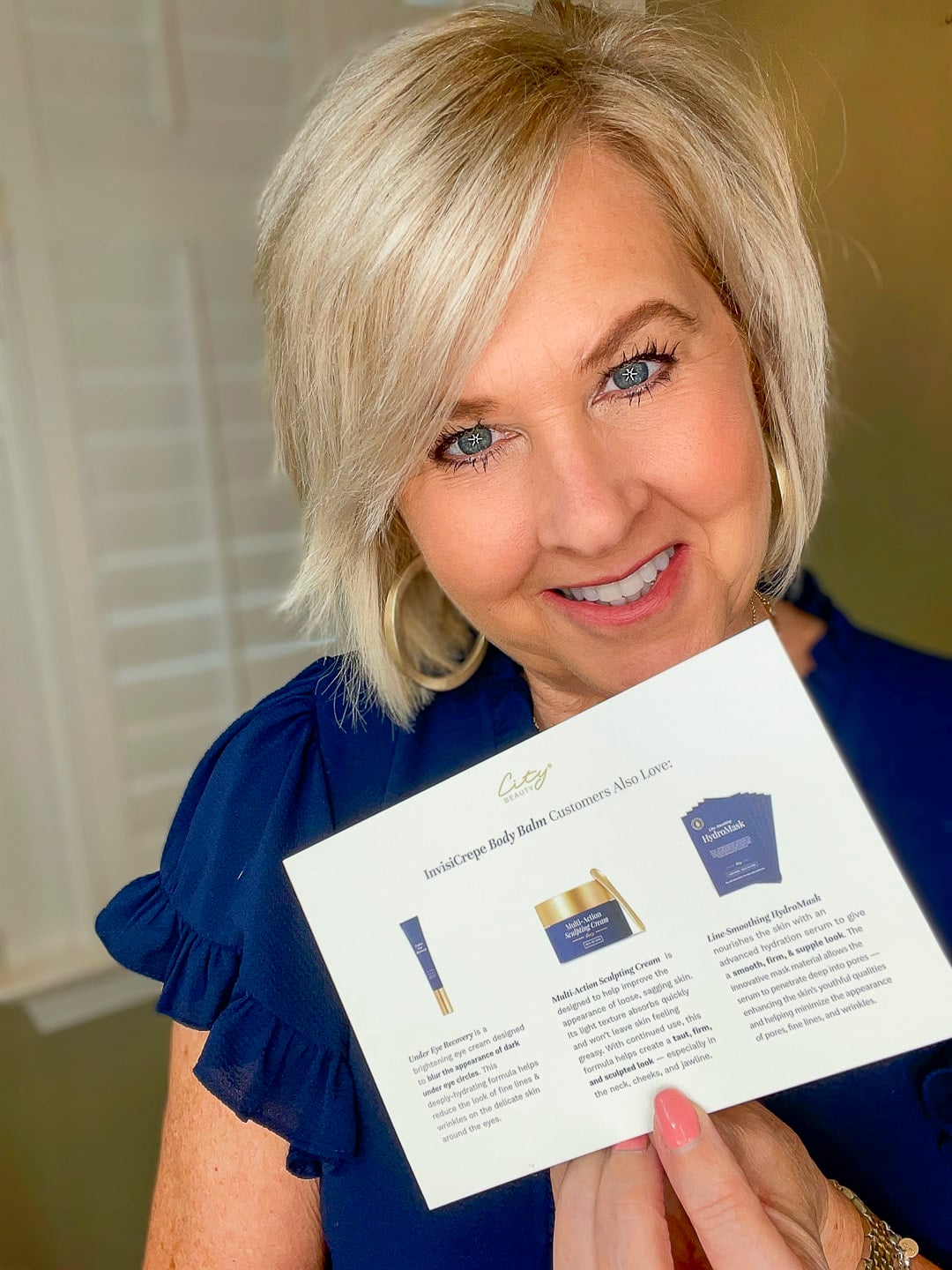 Over 40 Fashion Blogger, Tania Stephens is wearing a blue top and trying City Beauty's Inviscrepe Body Balm16