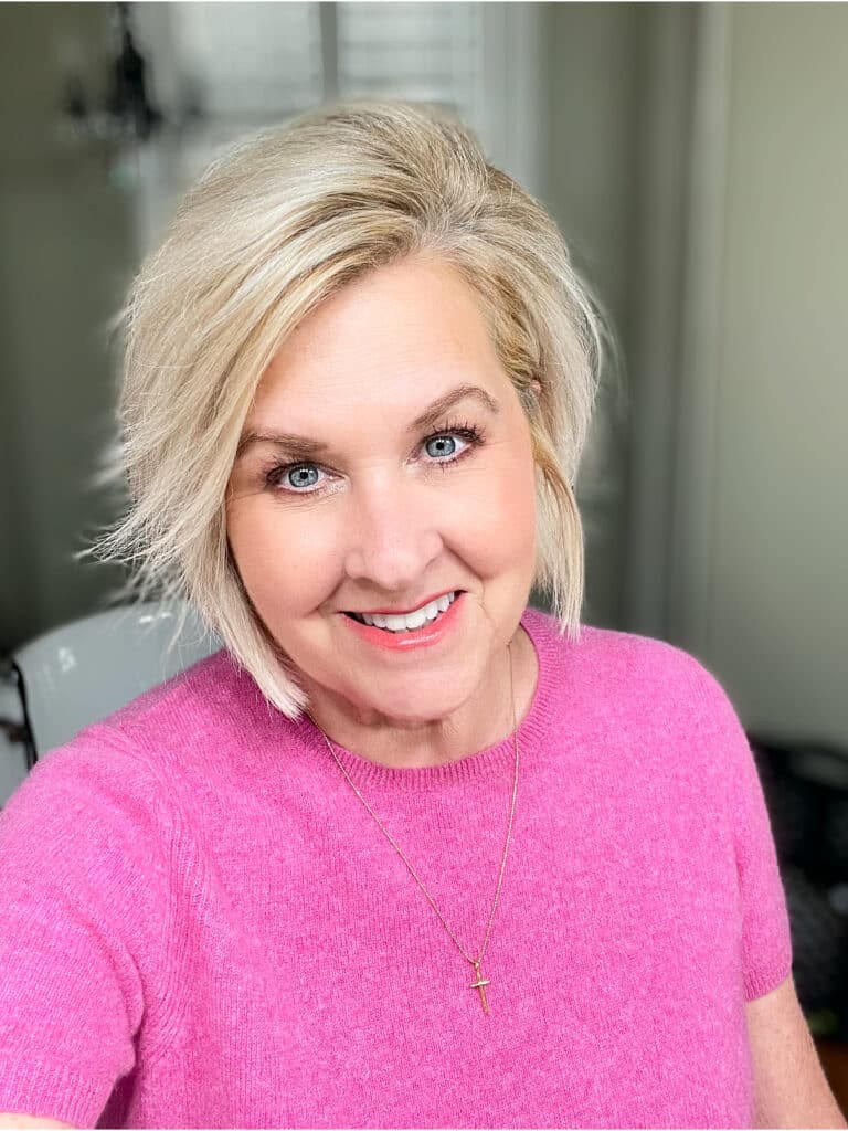 Over 40 Fashion Blogger, Tania Stephens is wearing a pink cashmere tee