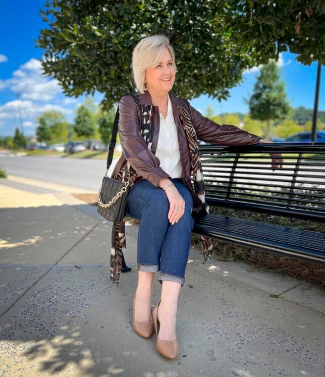 Over 40 Fashion Blogger, Tania Stephens is wearing a faux leather shacket with girlfriend jeans 7