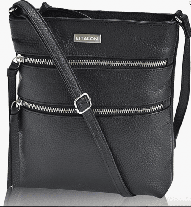 Over 40 Fashion Blogger, Tania Stephens is showing a black multi zip crossbody handbag from Amazon