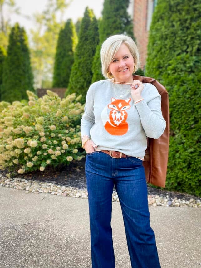 Over 40 Fashion Blogger, Tania Stephens is wearing a pair of trouser jeans with a fox sweater66
