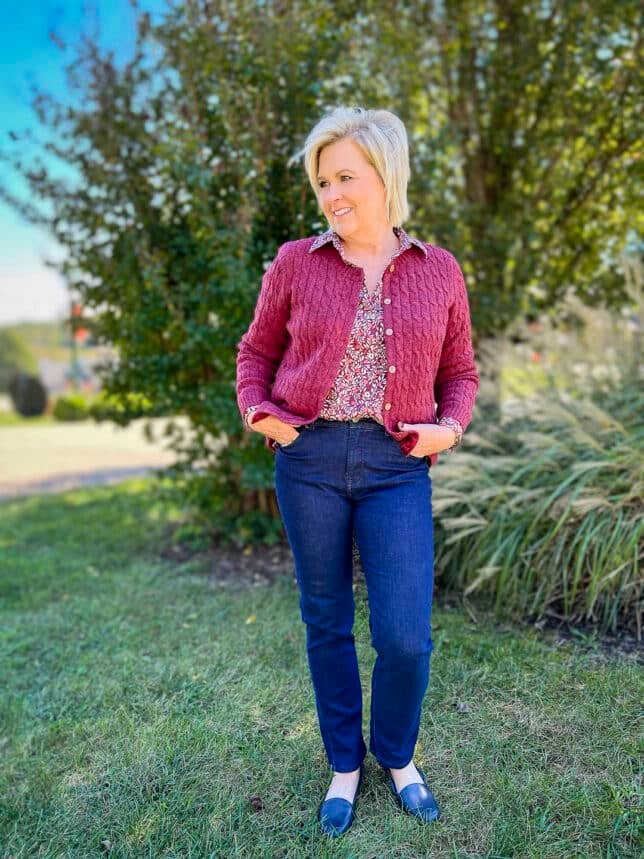 Over 40 Fashion Blogger, Tania Stephens is wearing a sweater with a floral top and jeans from Appleseeds 10