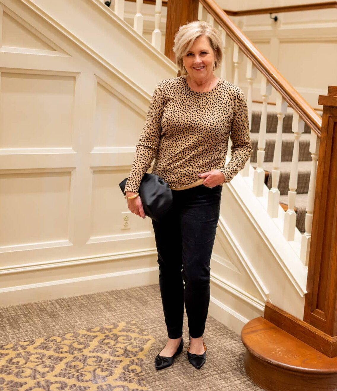Over 40 Fashion Blogger, Tania Stephens is wearing a leopard print sweater and black pants1062