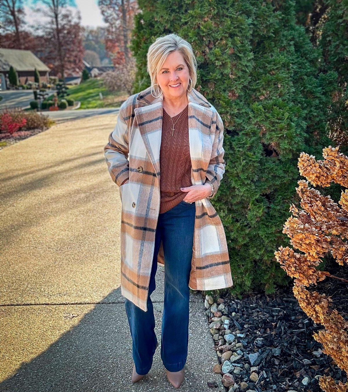 Over 40 Fashion Blogger, Tania Stephens is wearing a sweater and jeans outfit for fall14