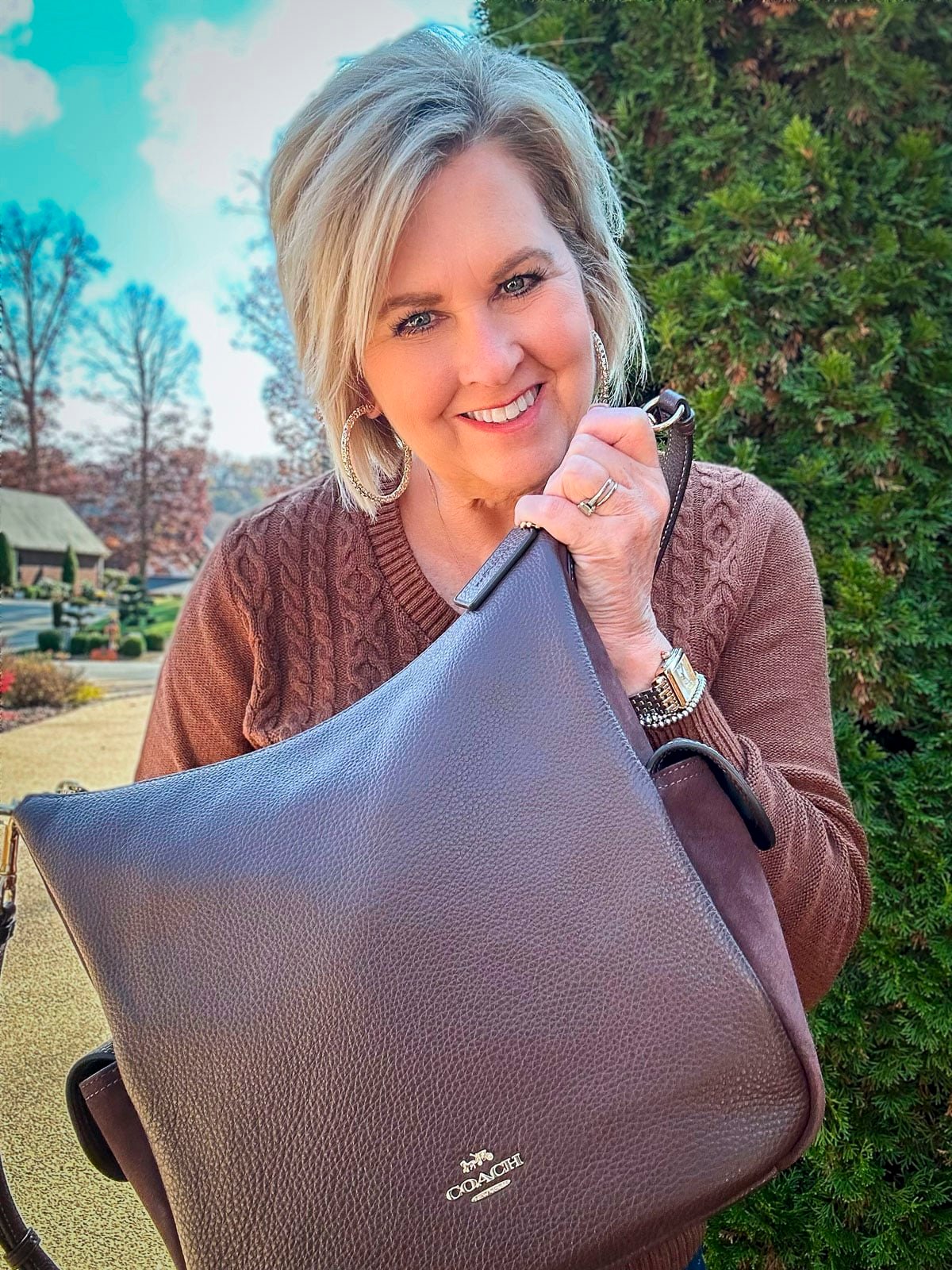 Over 40 Fashion Blogger, Tania Stephens is wearing a sweater and jeans outfit for fall3