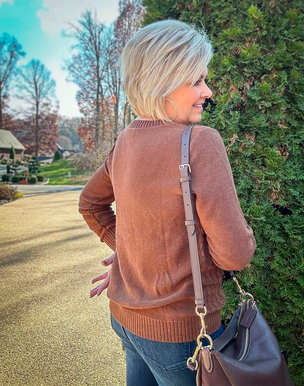 Over 40 Fashion Blogger, Tania Stephens is wearing a sweater and jeans outfit for fall6