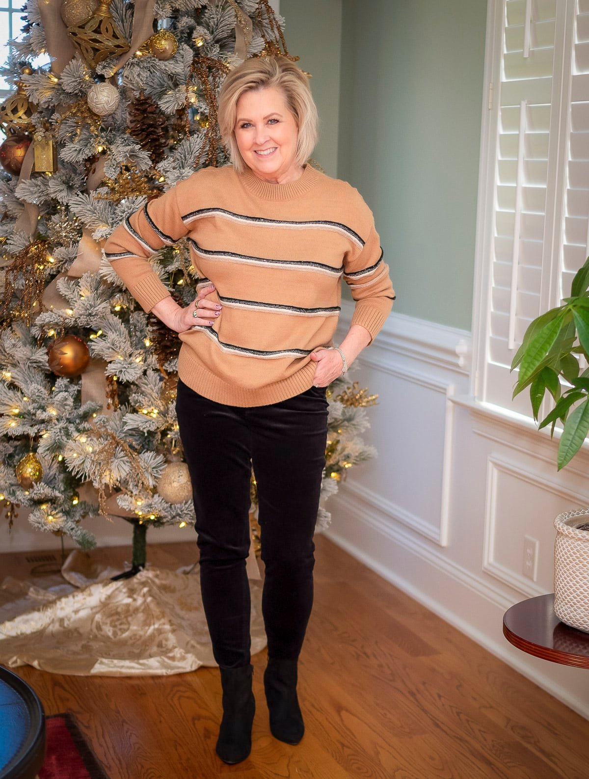 Over 40 Fashion Blogger, Tania Stephens is wearing a camel and black striped sweater with black pants12