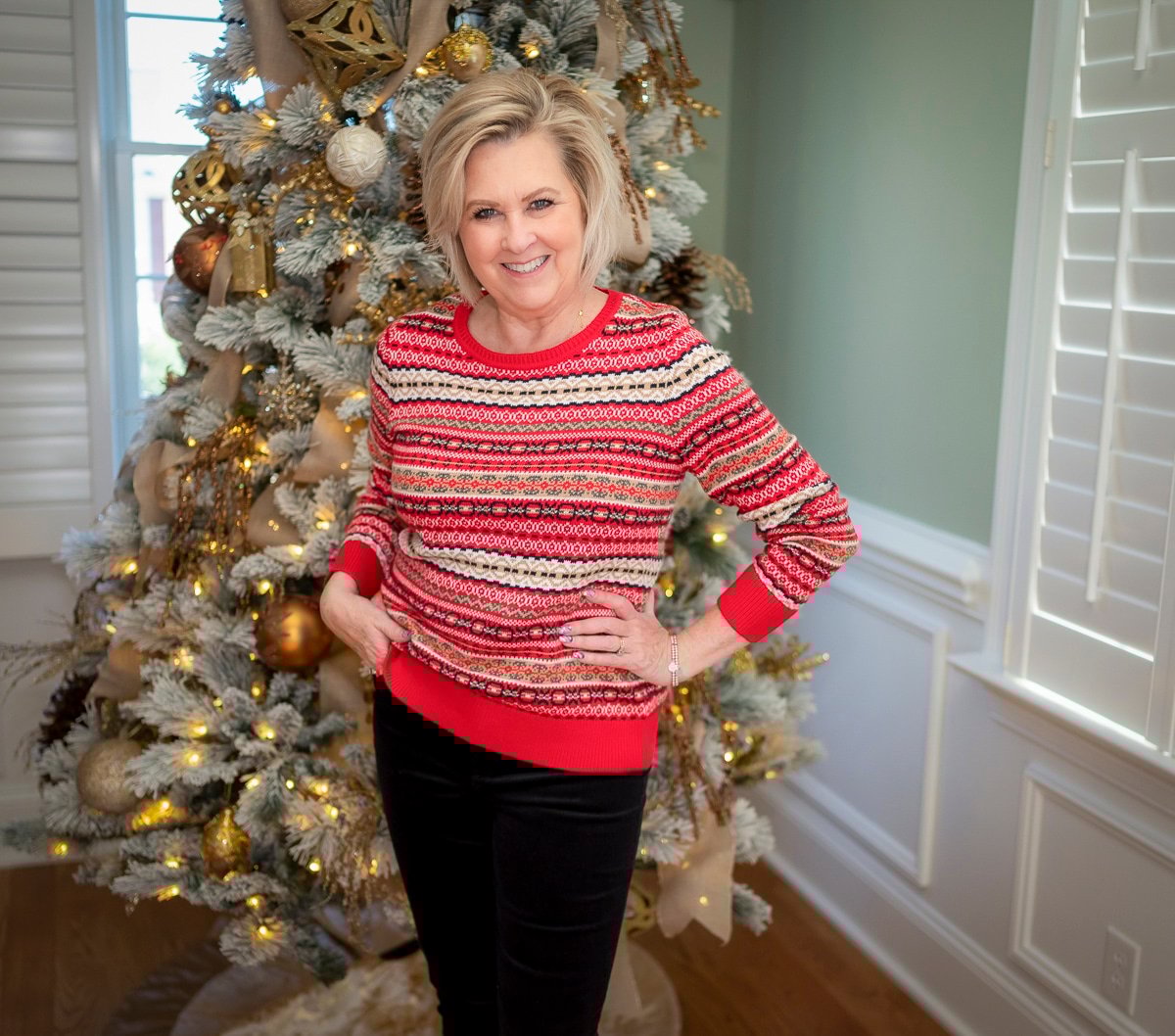 Over 40 Fashion Blogger, Tania Stephens is wearing a red Fairisle sweater with black pants 7
