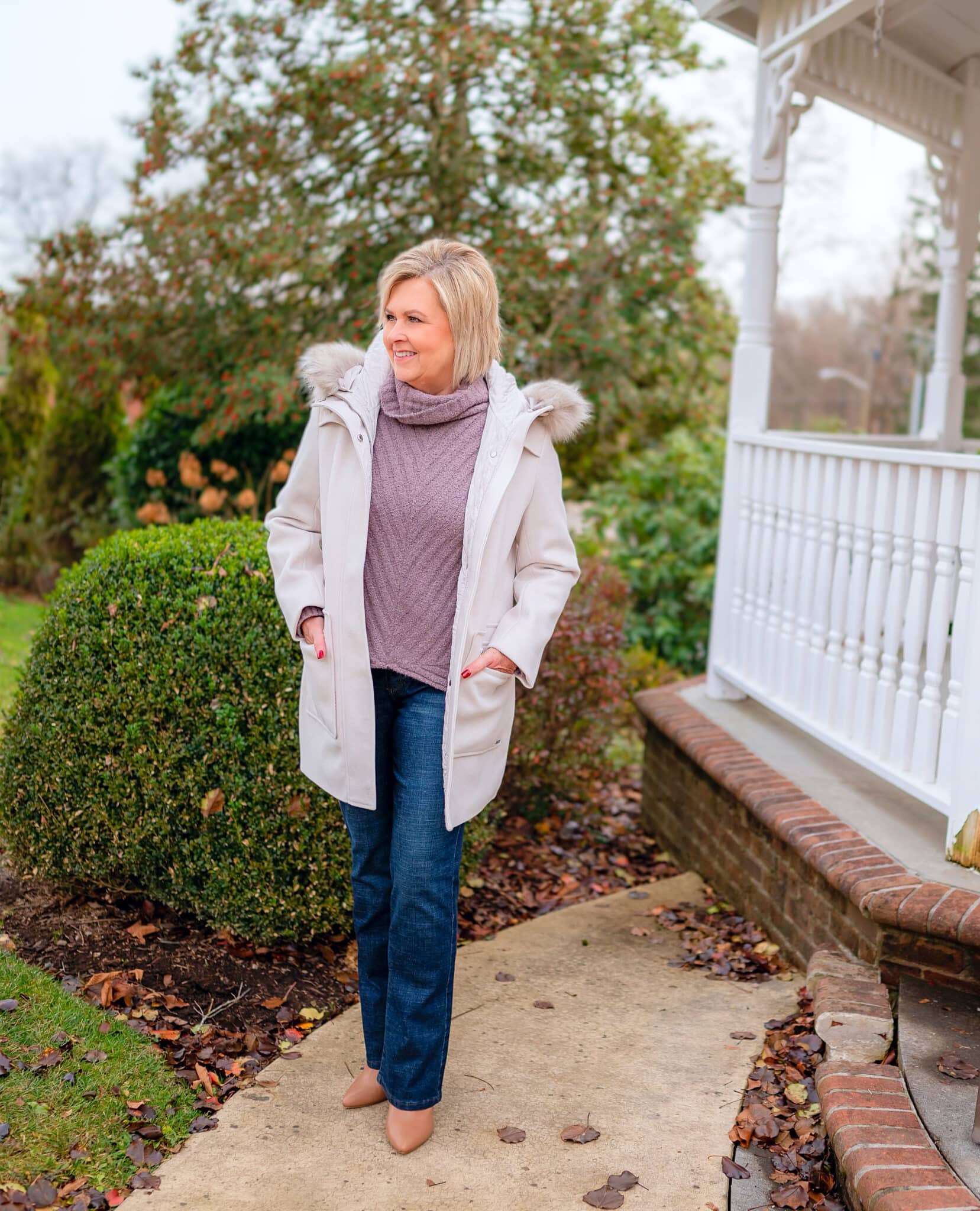 Over 40 Fashion Blogger, Tania Stephens is wearing a coat with a fur collar with jeans from Kohl's 1