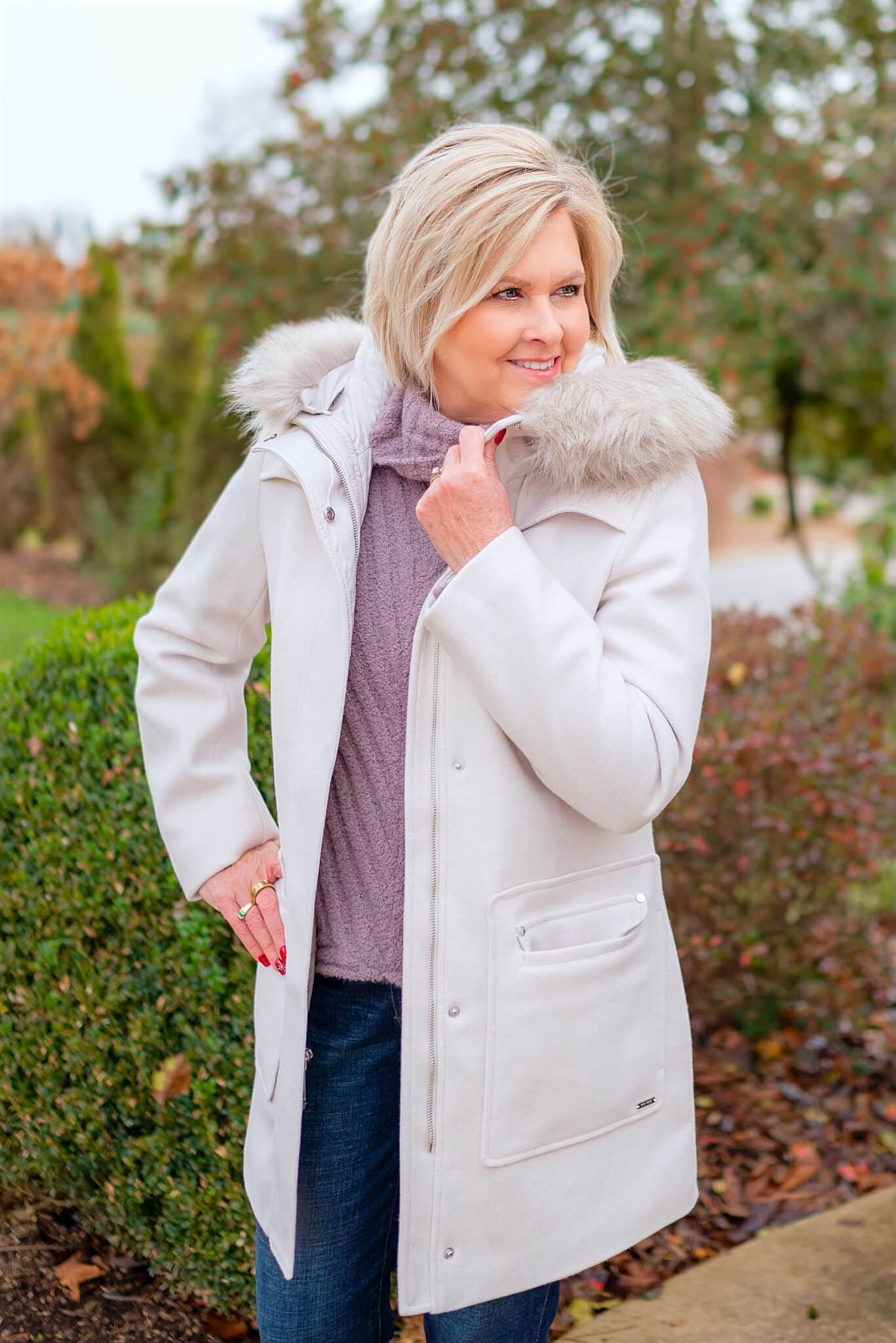 Over 40 Fashion Blogger, Tania Stephens is wearing a coat with a fur collar with jeans from Kohl's3