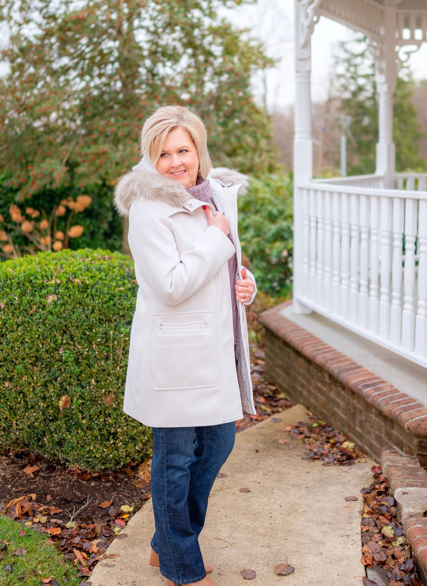 Over 40 Fashion Blogger, Tania Stephens is wearing a coat with a fur collar with jeans from Kohl's5