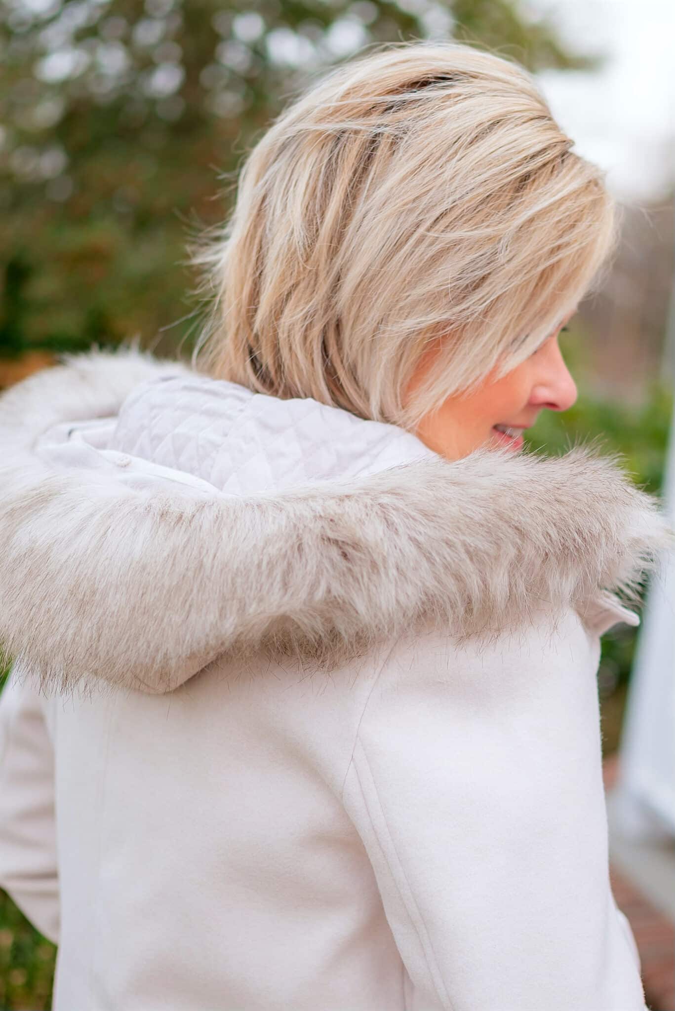Over 40 Fashion Blogger, Tania Stephens is wearing a coat with a fur collar with jeans from Kohl's6