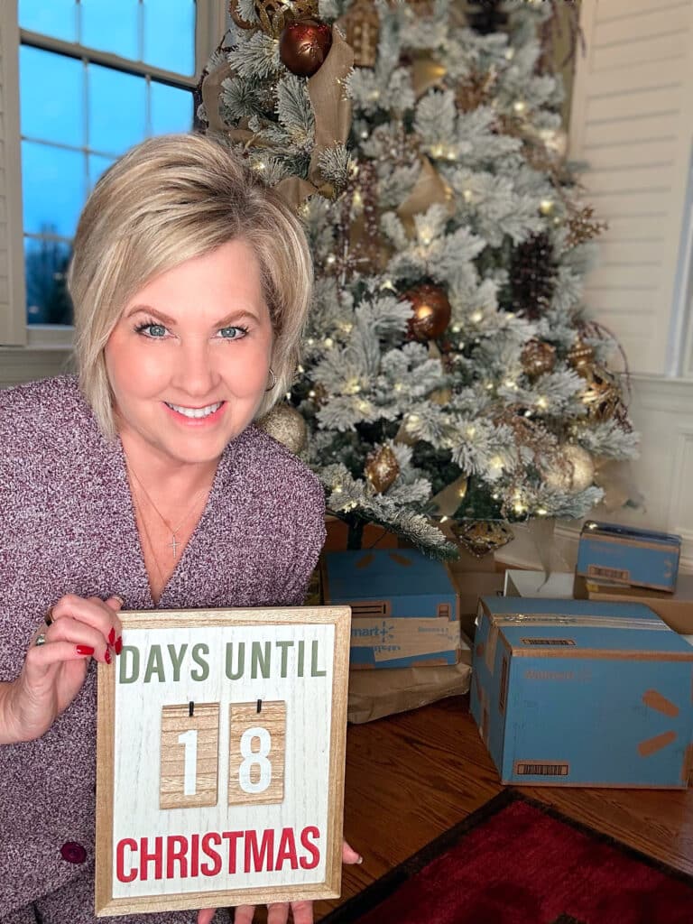Over 40 Fashion Blogger, Tania Stephens is holding an countdown to Christmas sign