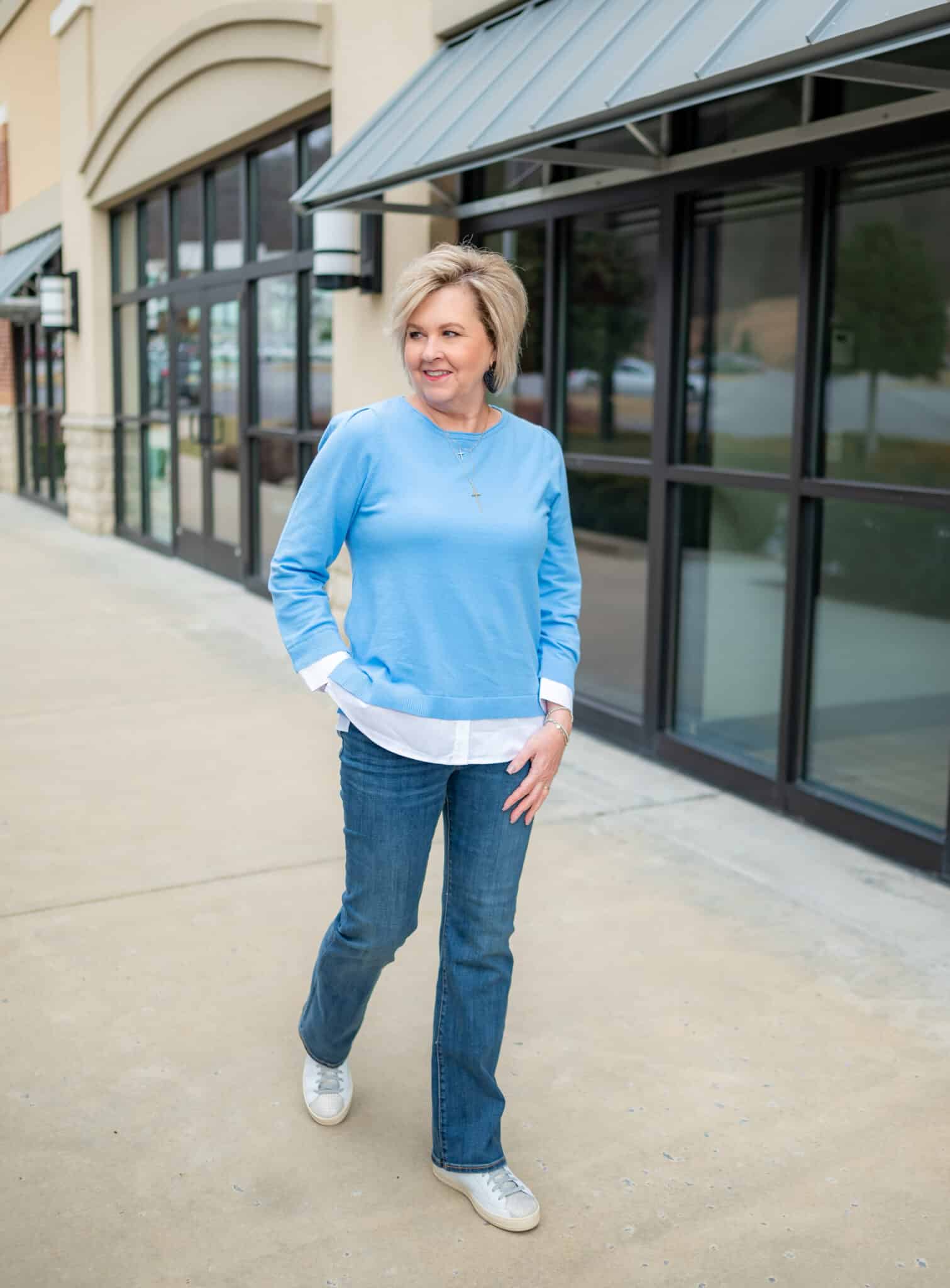 Tania Stephens from 50 Is Not Old is wearing a Chico's blue sweater with a built in white top6