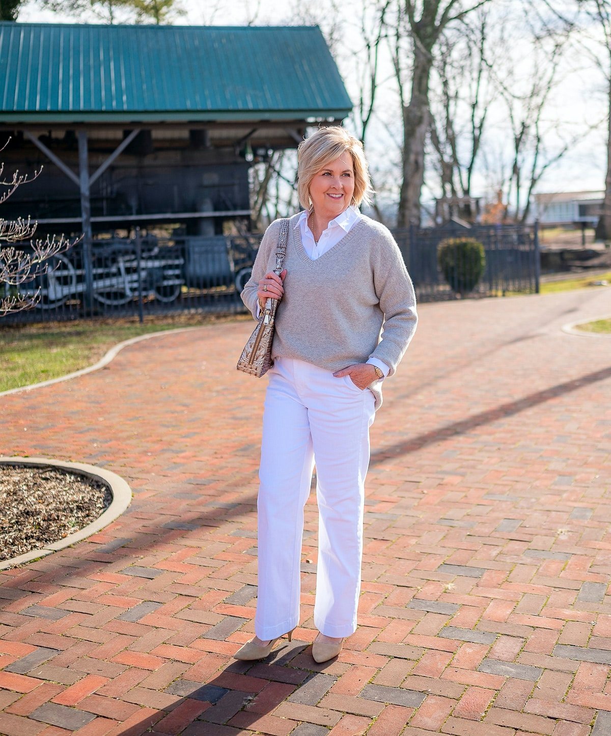 50 Is Not Old is wearing white wide leg pants and a cashmere sweater and is casual elegance1