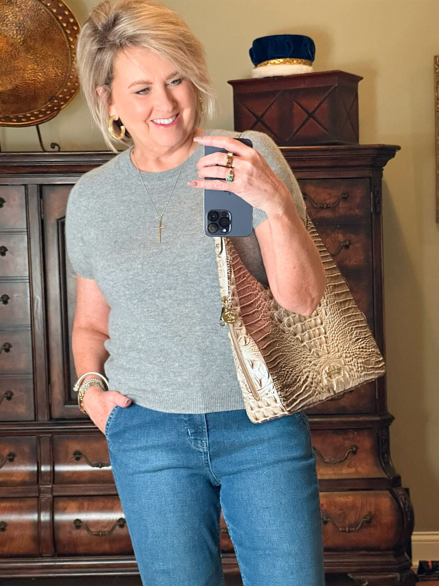 Fashion Blogger, Tania Stephens is wearing flare jeans and a gray 1