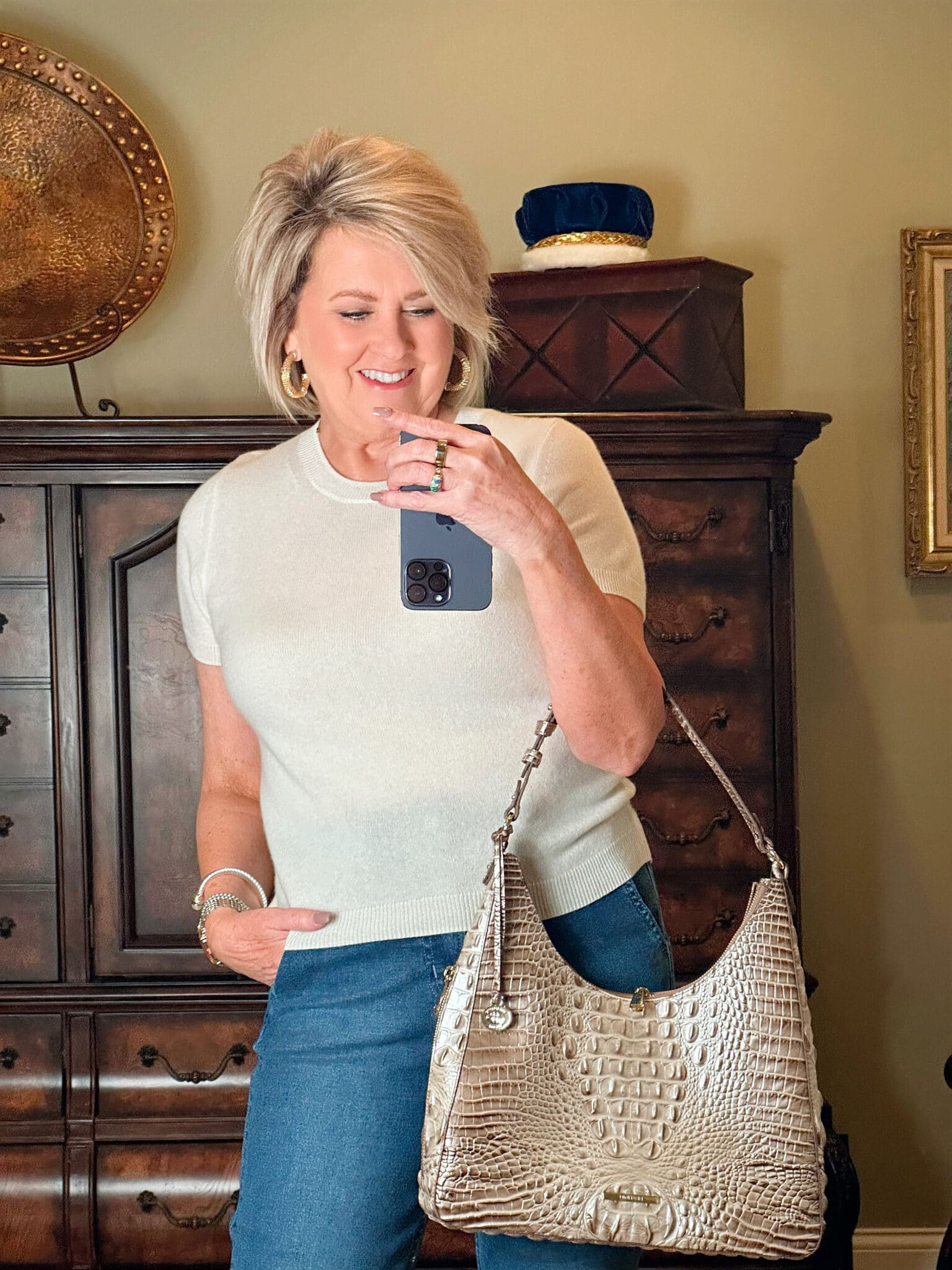 Fashion Blogger, Tania Stephens is wearing flare jeans and a white cashmere tee under $50 9
