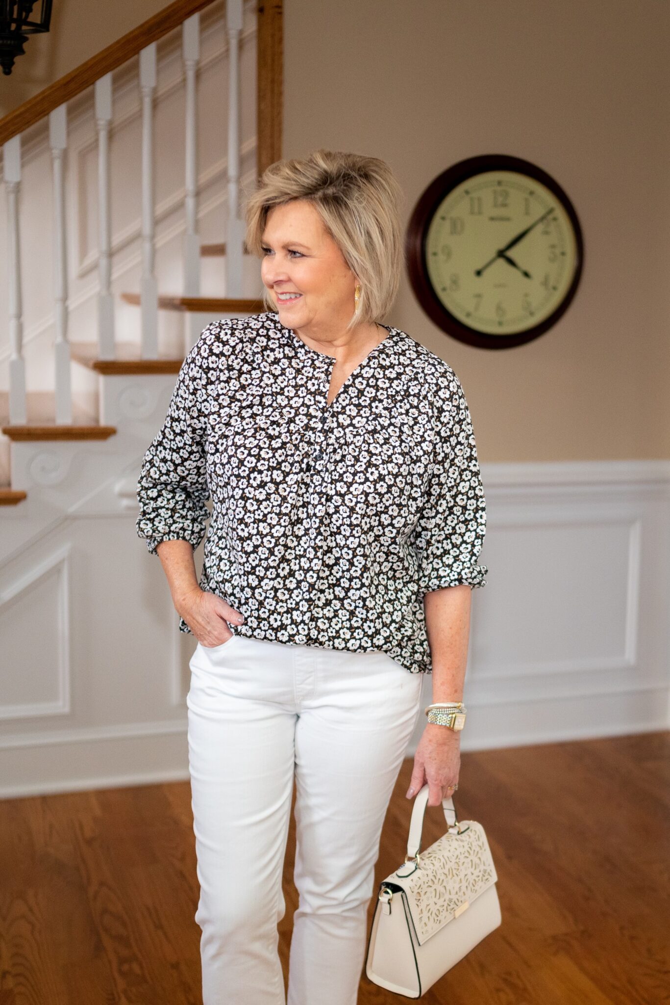 Fashion Blogger, 50 is not old is wearing white jeans and a black & white blouse from Kohls1
