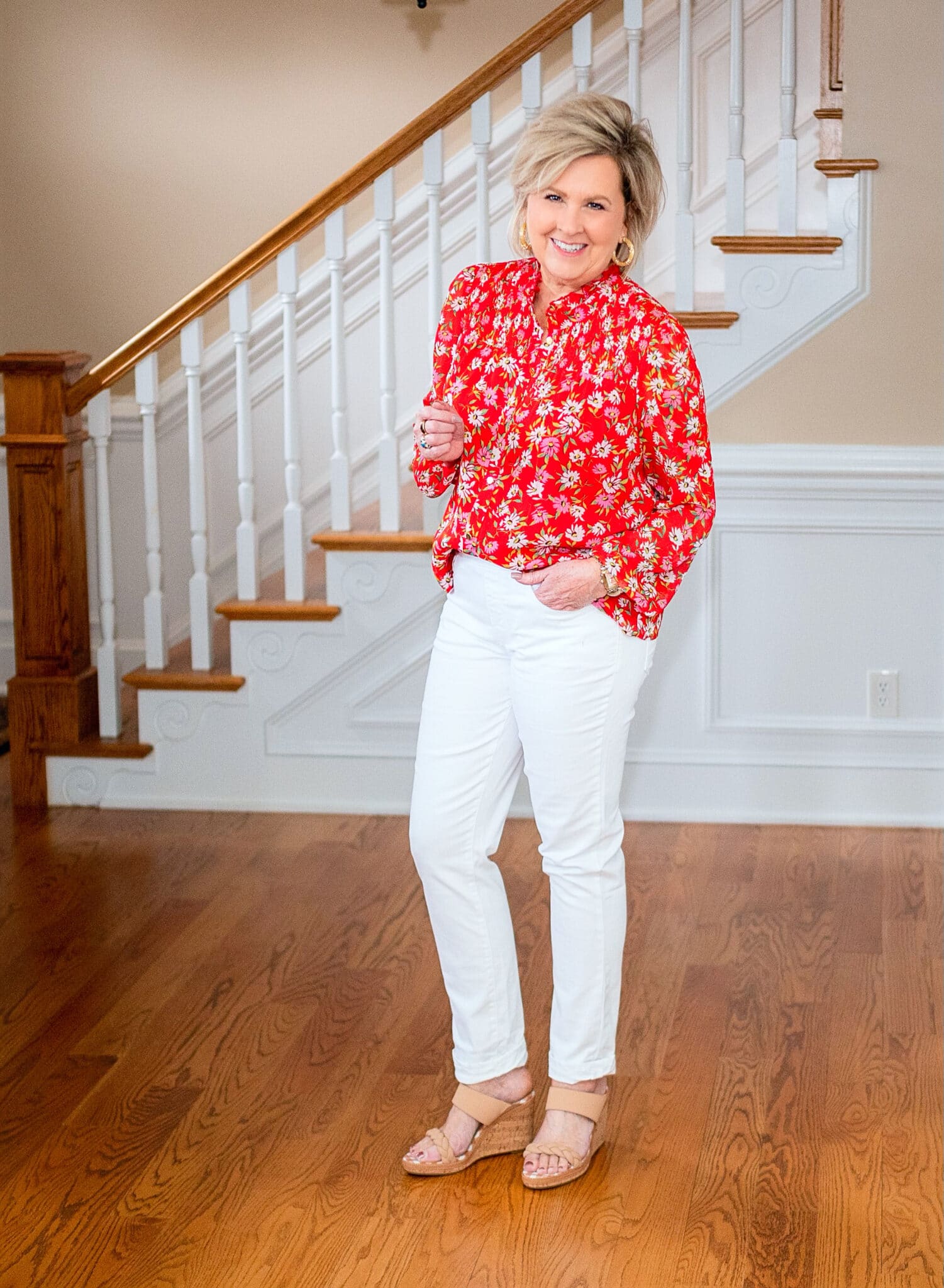 Fashion Blogger, 50 is not old is wearing white jeans and a red floral blouse from Kohls4