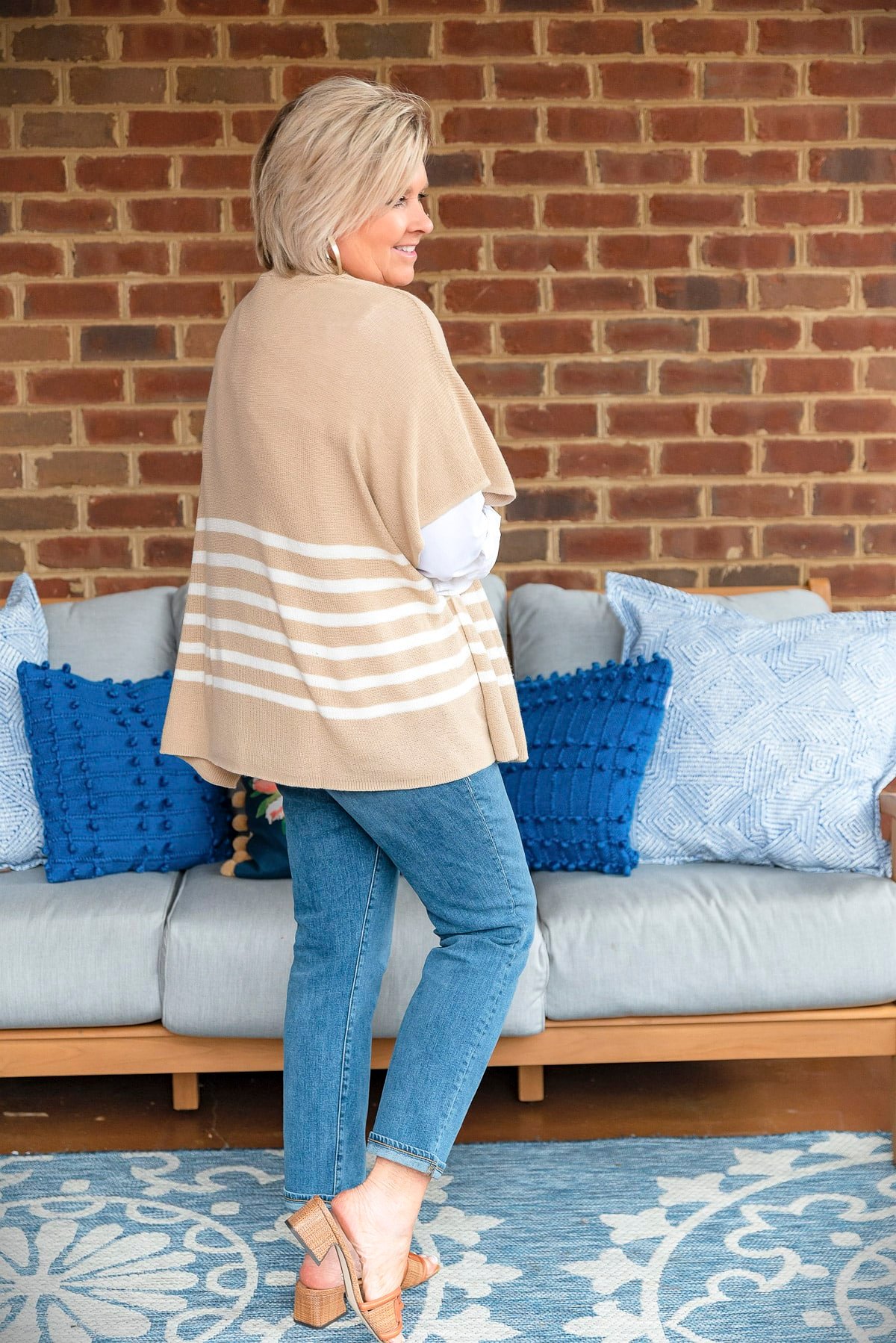 Fashion Blogger, 50 Is Not Old is showing ways to style a white button up shirt with a poncho10