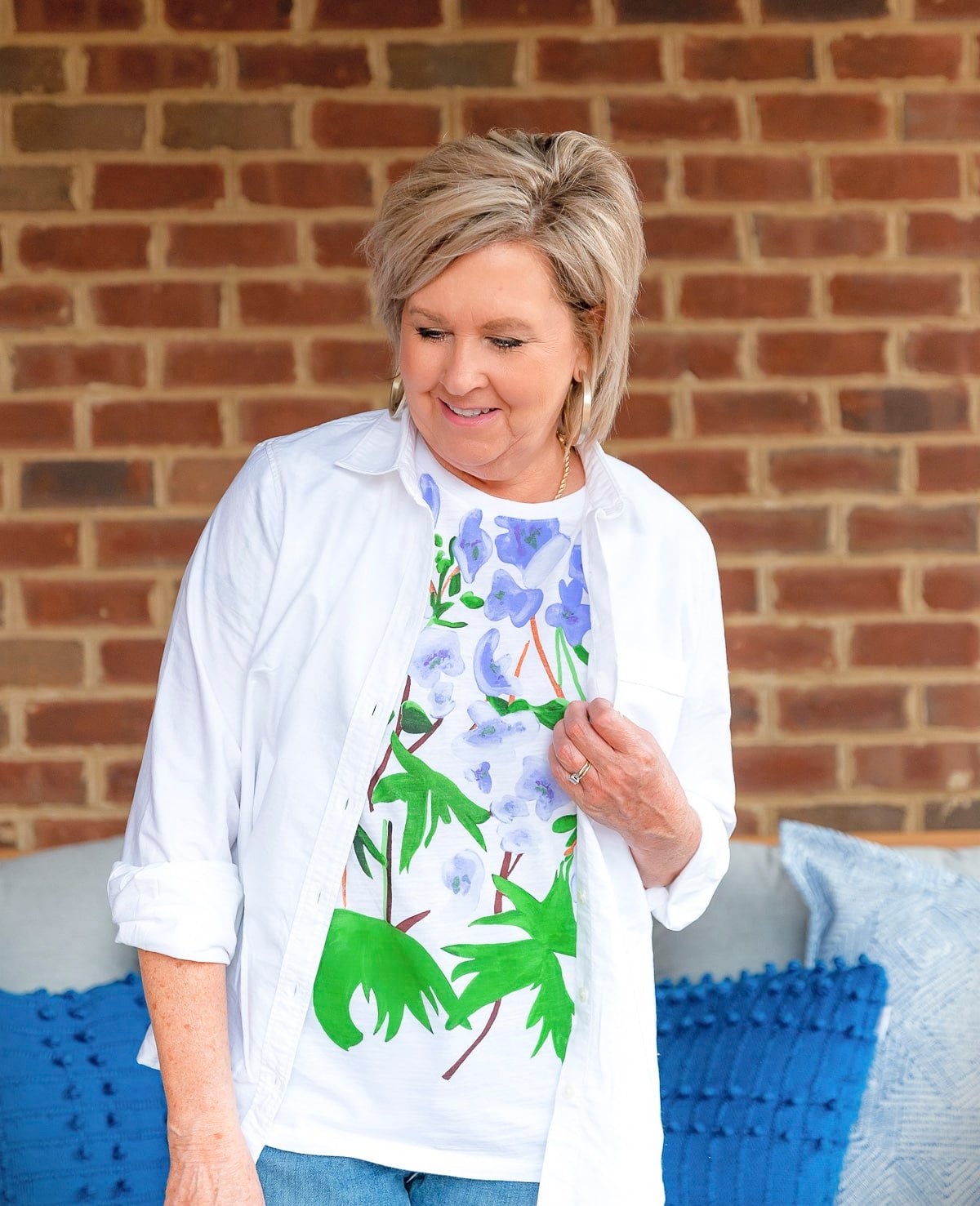 Fashion Blogger, 50 Is Not Old is showing ways to style a white button up shirt with jeans and a graphic tee28