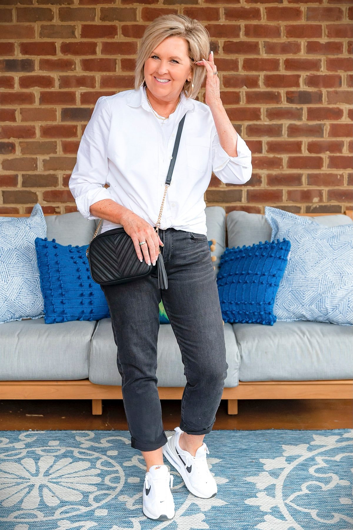 Fashion Blogger, 50 Is Not Old is showing ways to style a white button up shirt with black jeans33